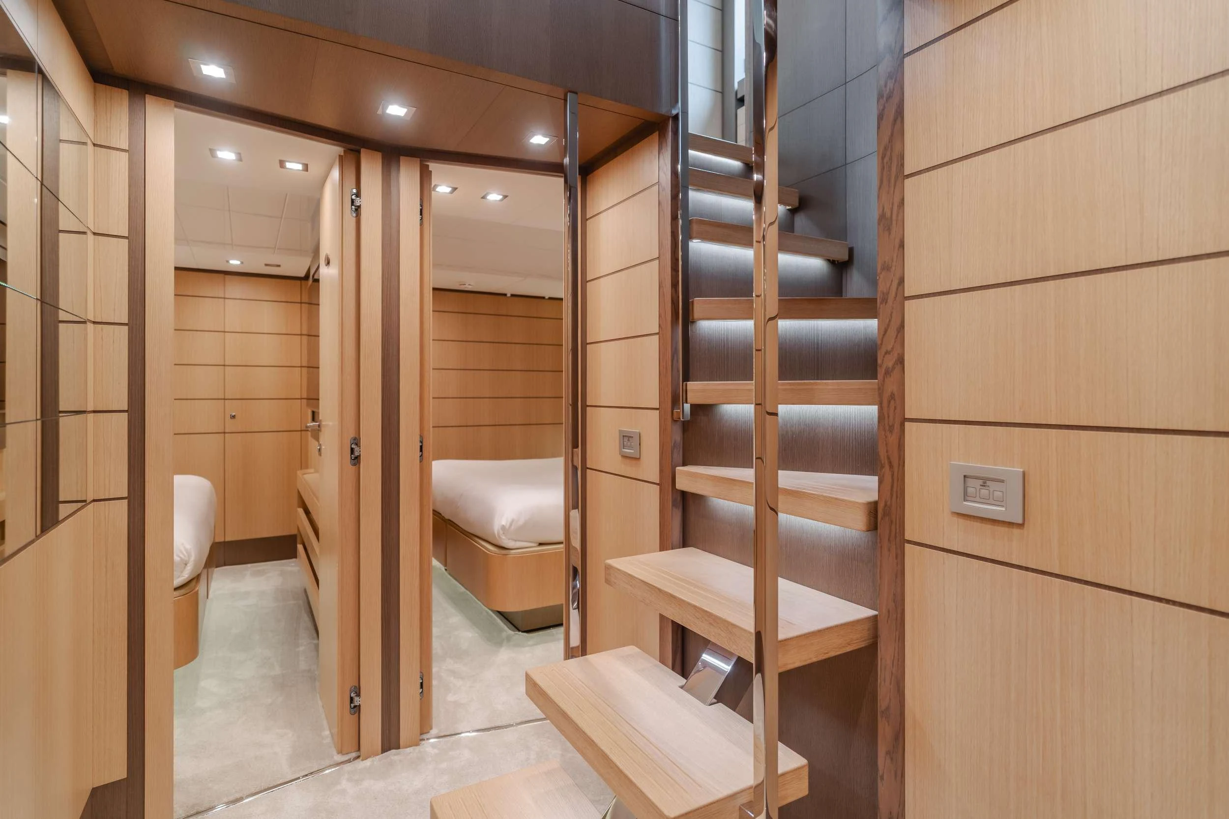 a room with a wood staircase and a wood door aboard SOL SHINE Yacht for Charter
