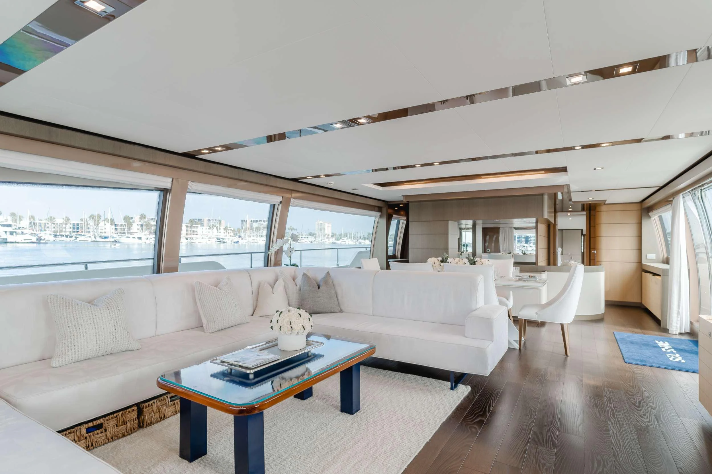 a living room with a large window aboard SOL SHINE Yacht for Charter
