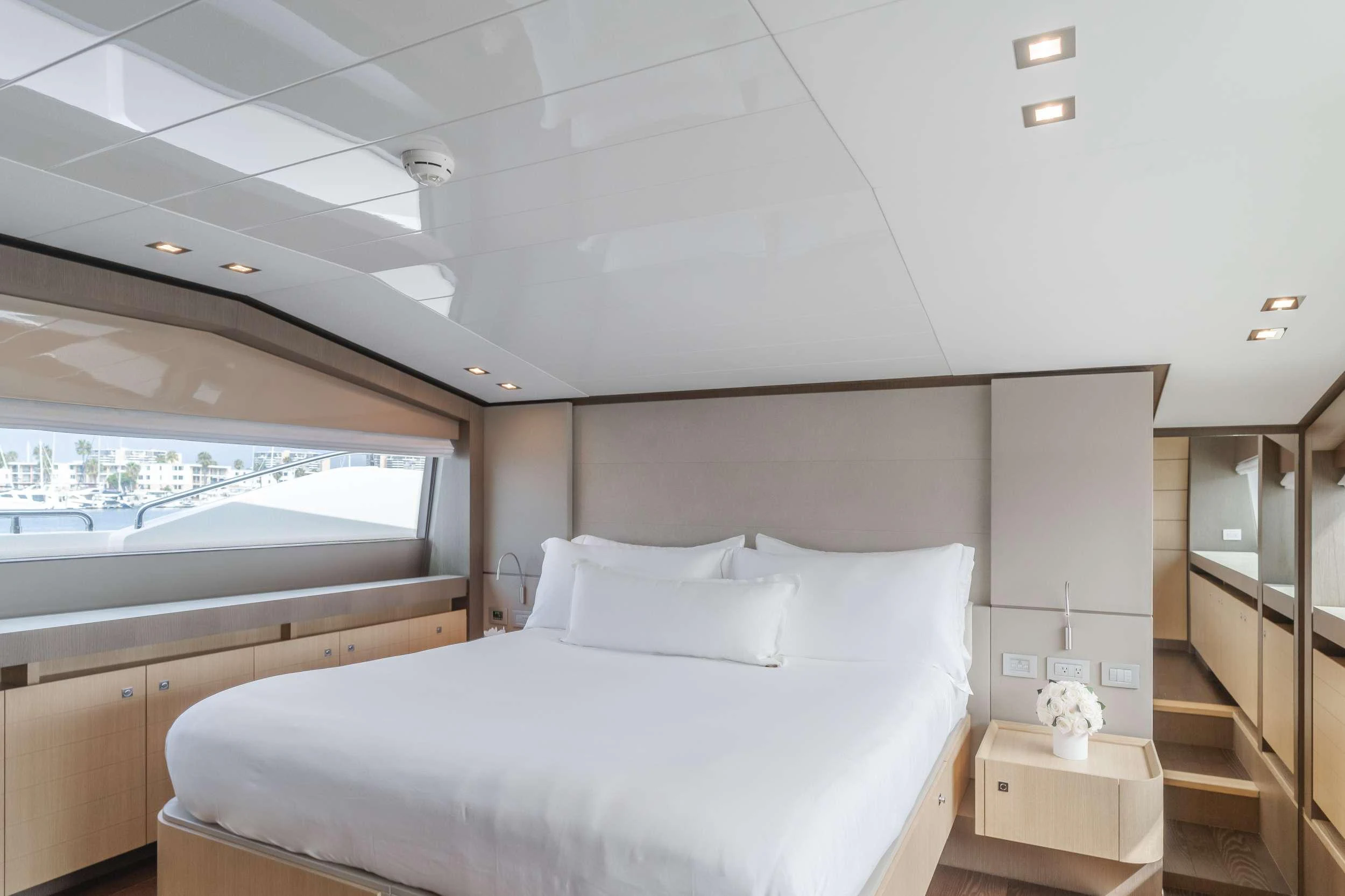a room with a bed and a window aboard SOL SHINE Yacht for Charter