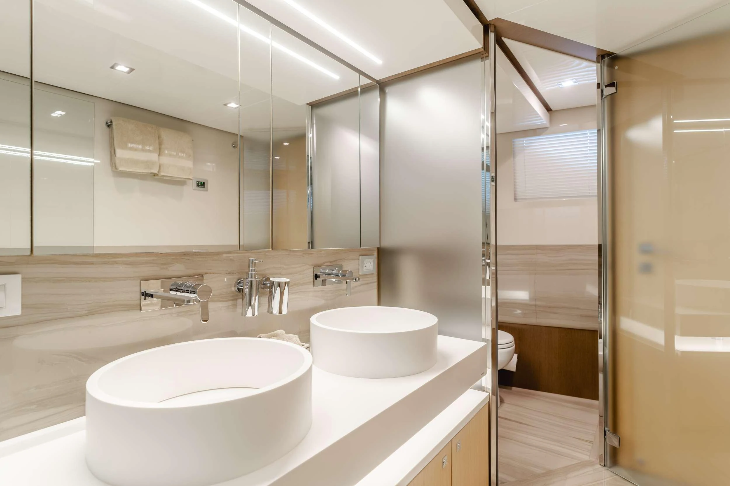 a bathroom with a sink and a mirror aboard SOL SHINE Yacht for Charter