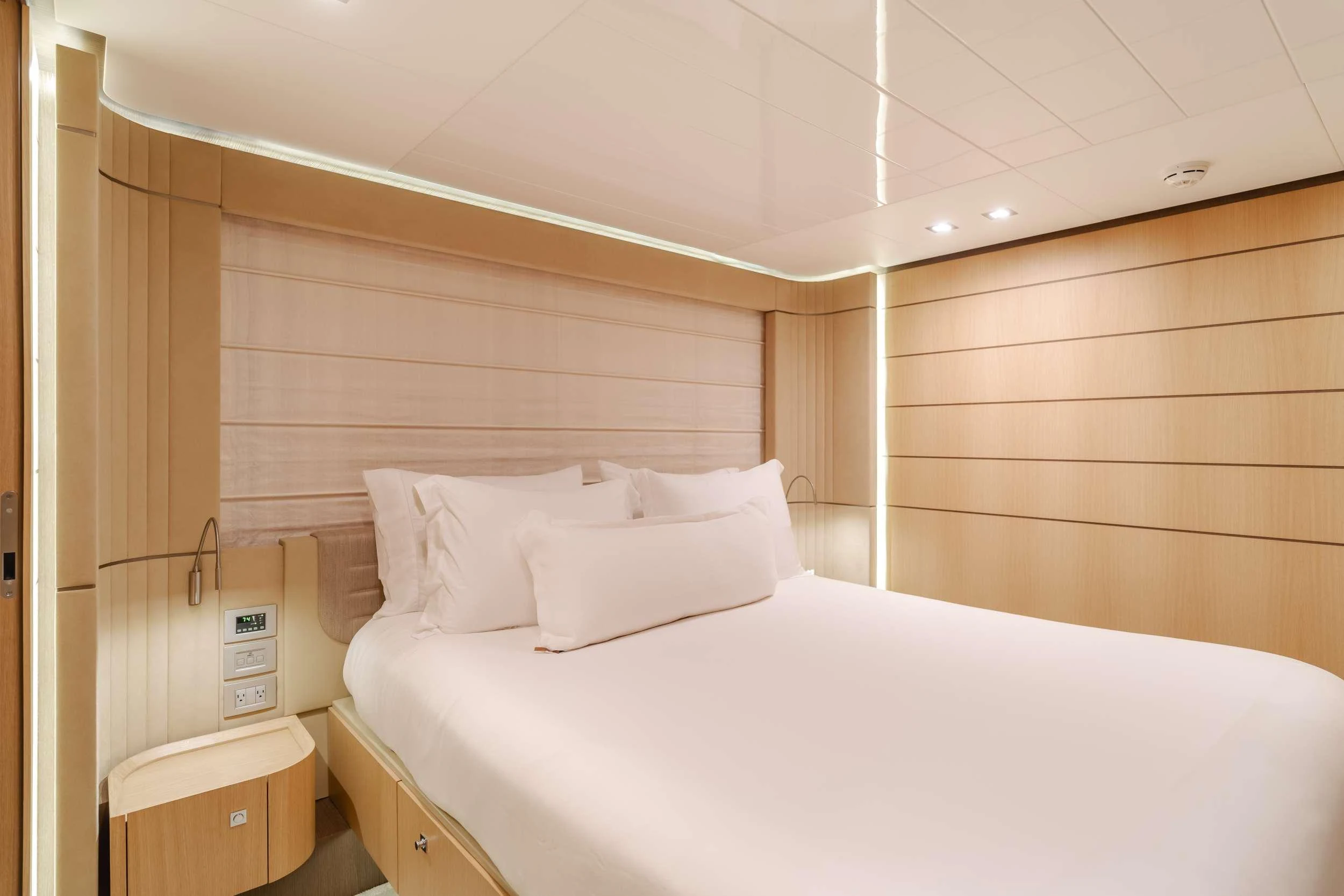 a room with a bed and a desk aboard SOL SHINE Yacht for Charter
