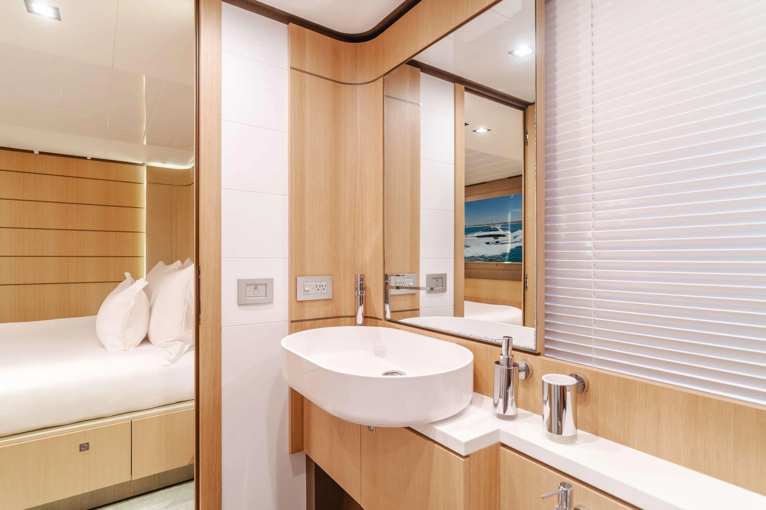 a bathroom with a large mirror aboard SOL SHINE Yacht for Charter