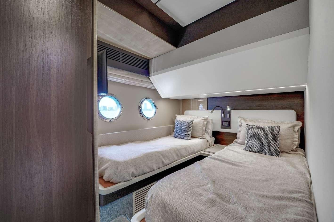 a room with two beds aboard THE ONE Yacht for Charter
