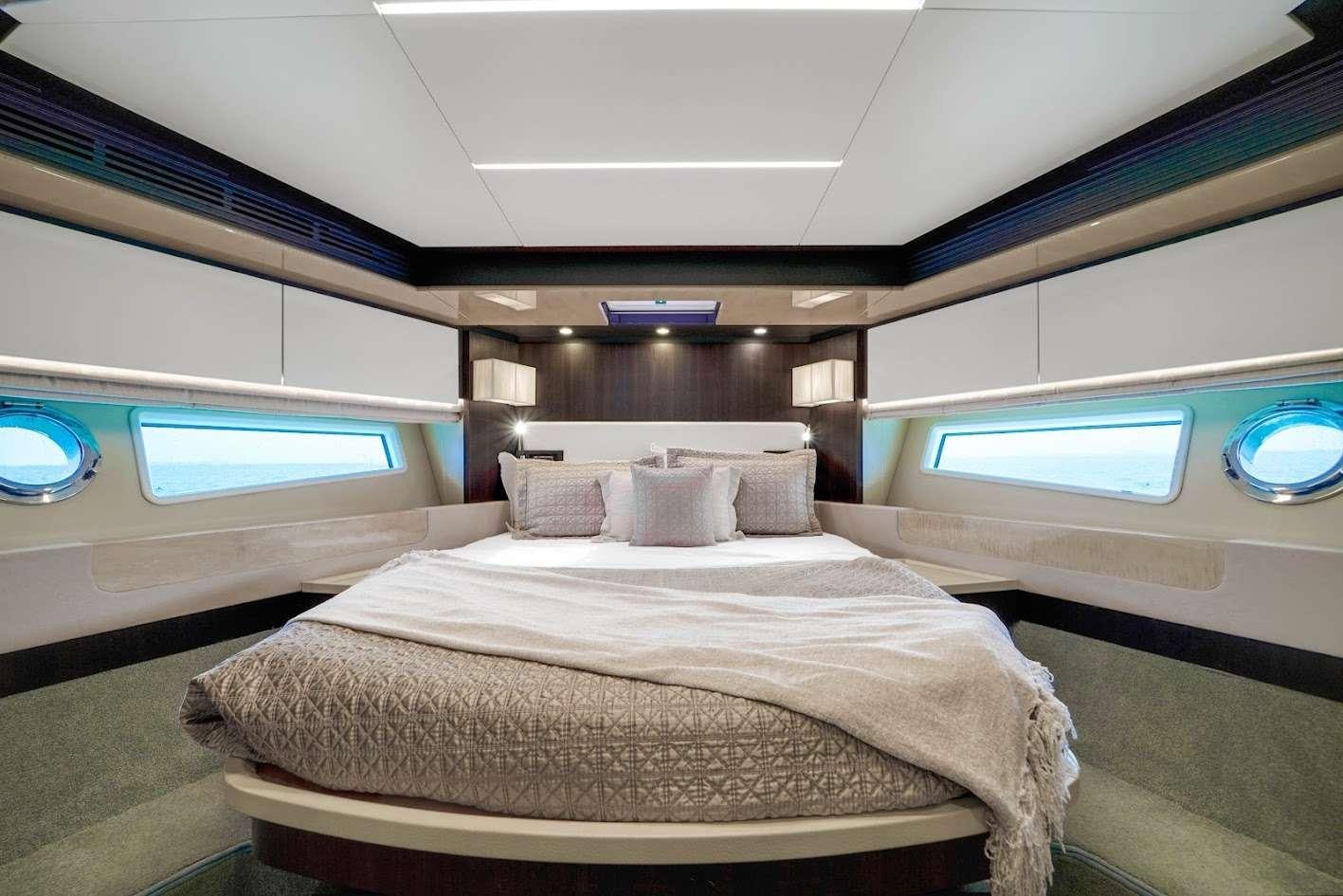 a bed in a room aboard THE ONE Yacht for Charter