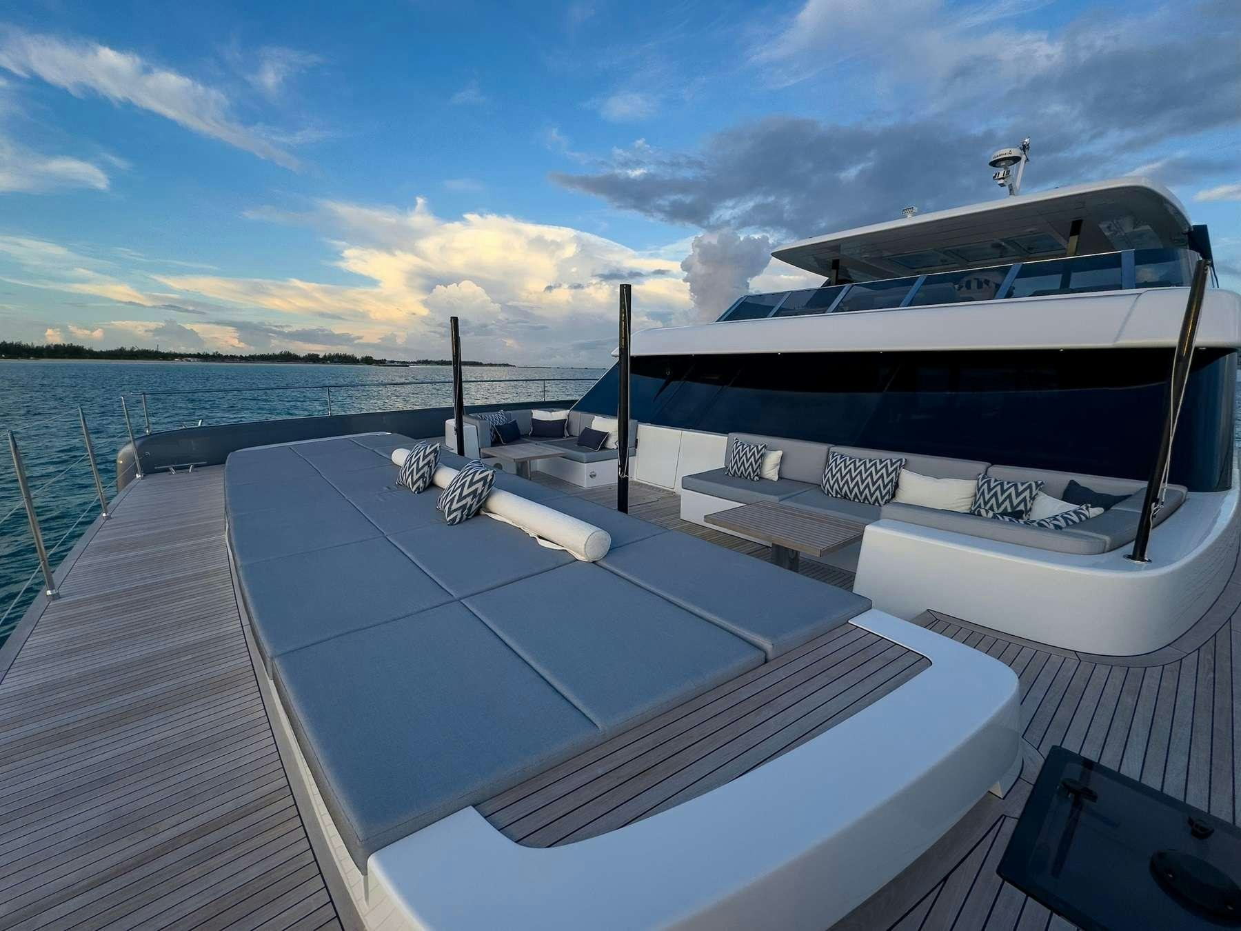a boat docked at a pier aboard BLESSED Yacht for Charter