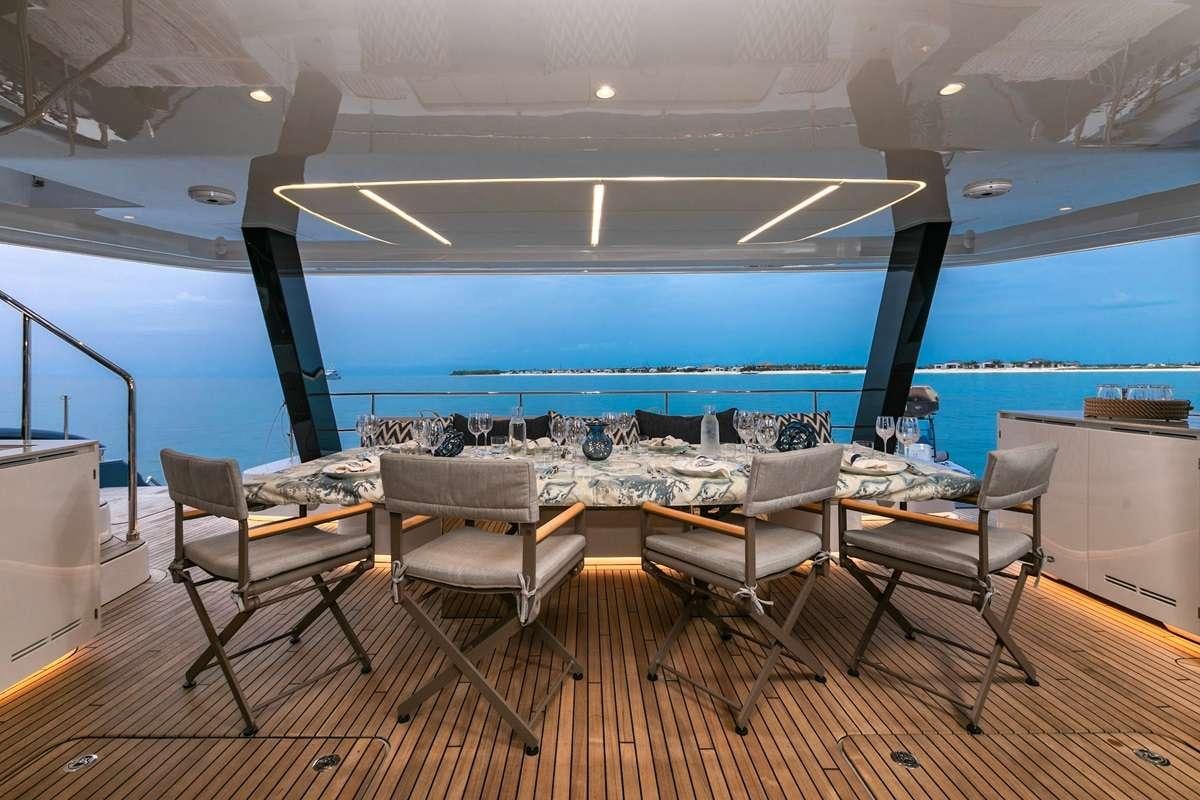 a room with a table and chairs aboard BLESSED Yacht for Charter