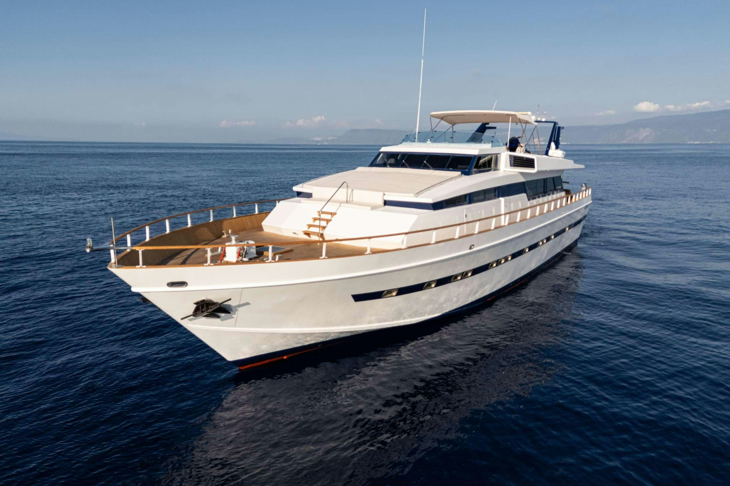 a white yacht in the water aboard OLGA Yacht for Charter