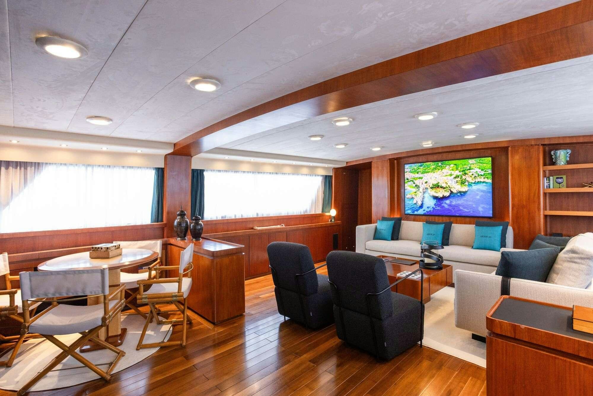 a living room with a large window aboard OLGA Yacht for Charter