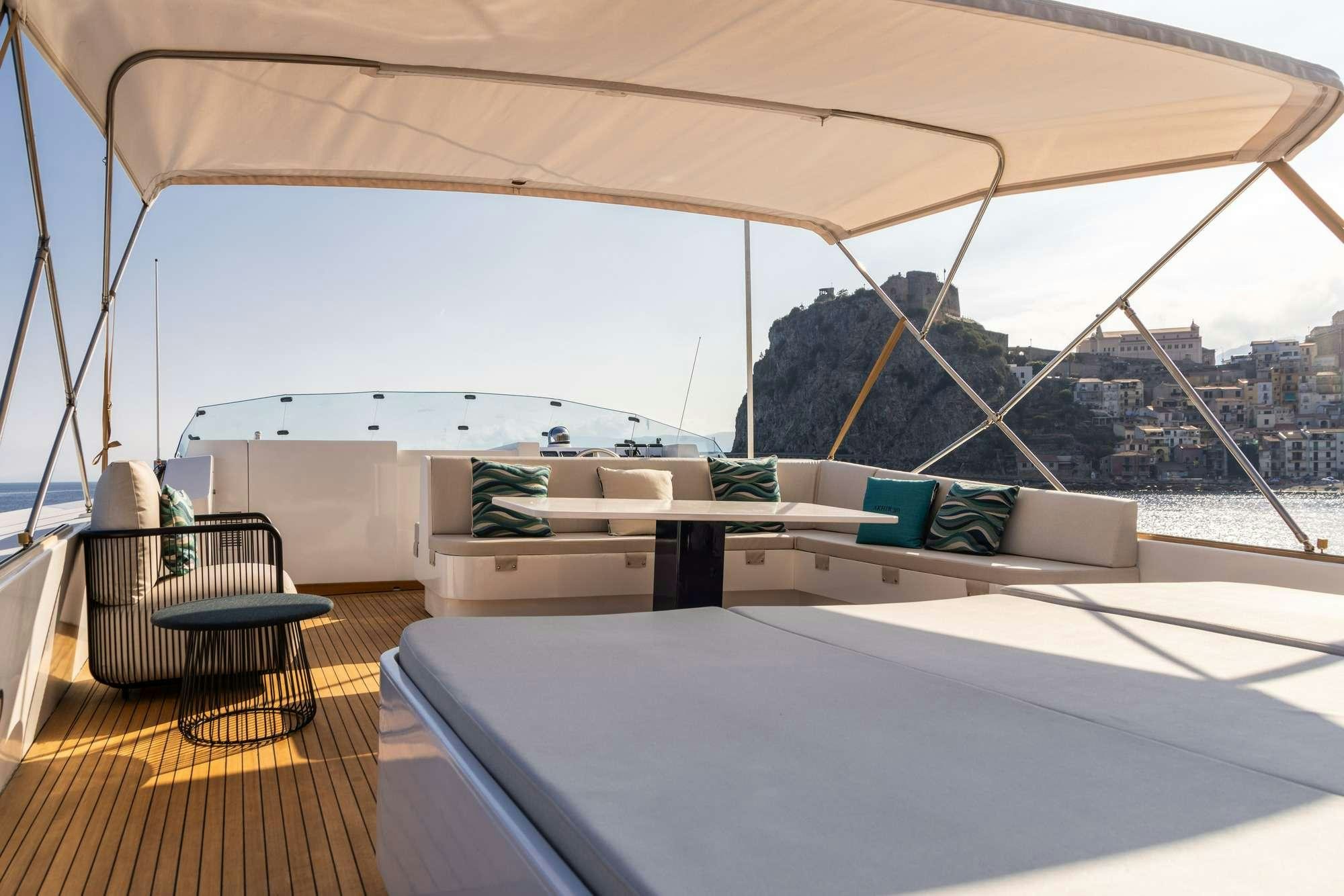 a room with a large window and a view of a city aboard OLGA Yacht for Charter