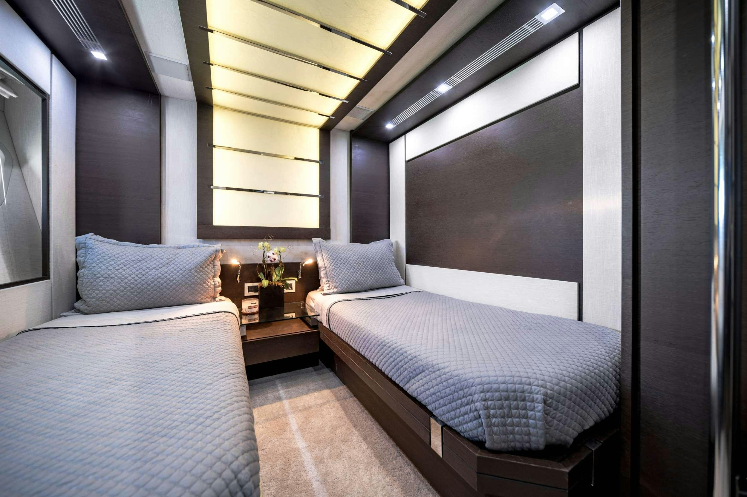 a room with two beds aboard SETTE Yacht for Charter