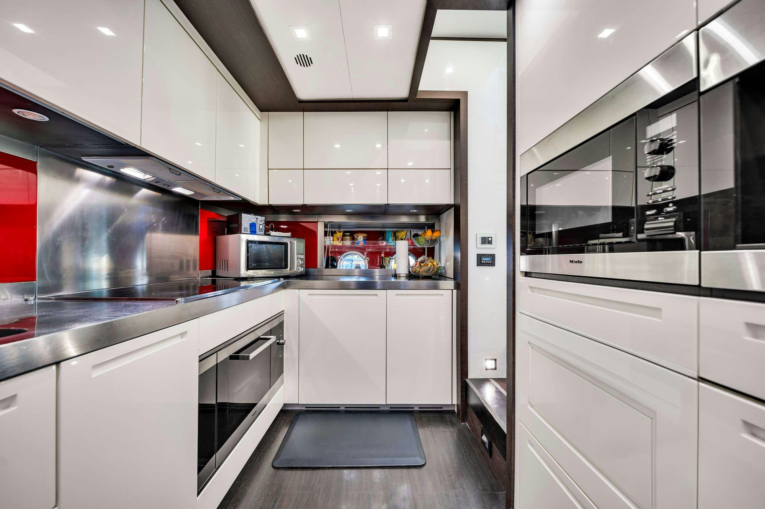 a kitchen with stainless steel appliances aboard SETTE Yacht for Charter