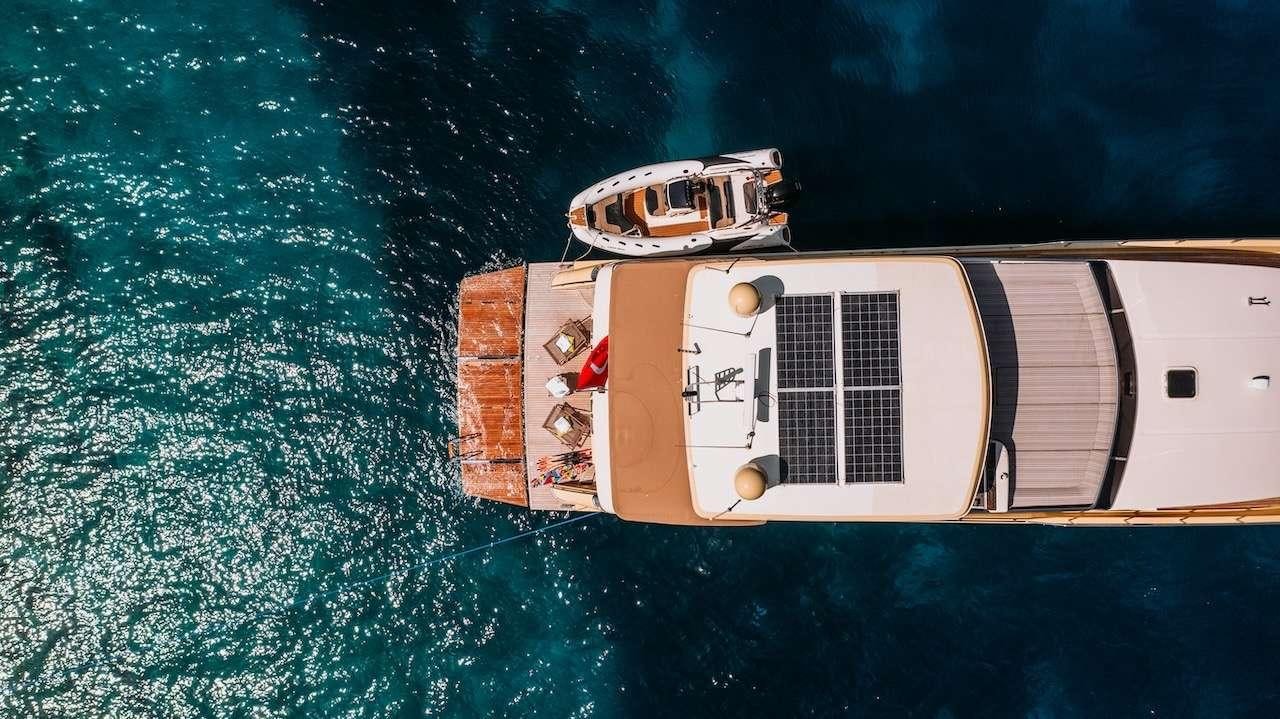 a satellite in outer space aboard REIS Yacht for Charter