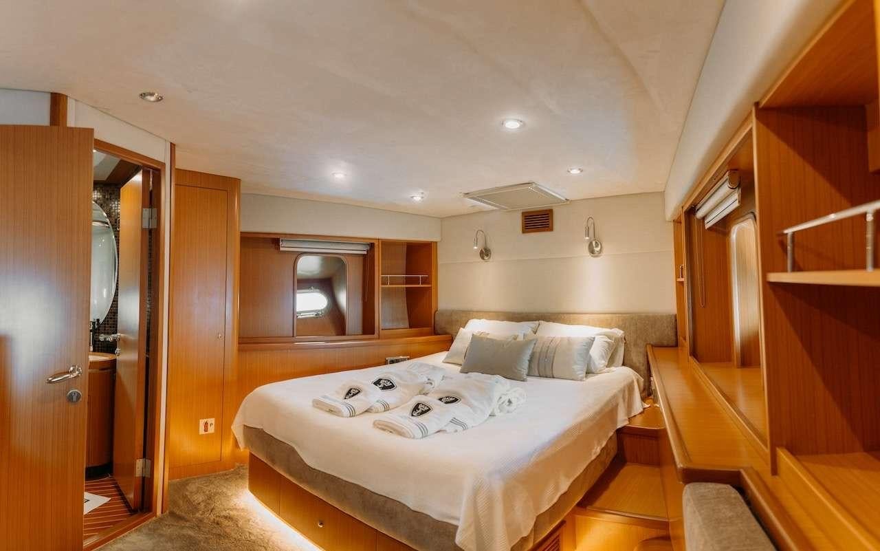 a room with two beds aboard REIS Yacht for Charter