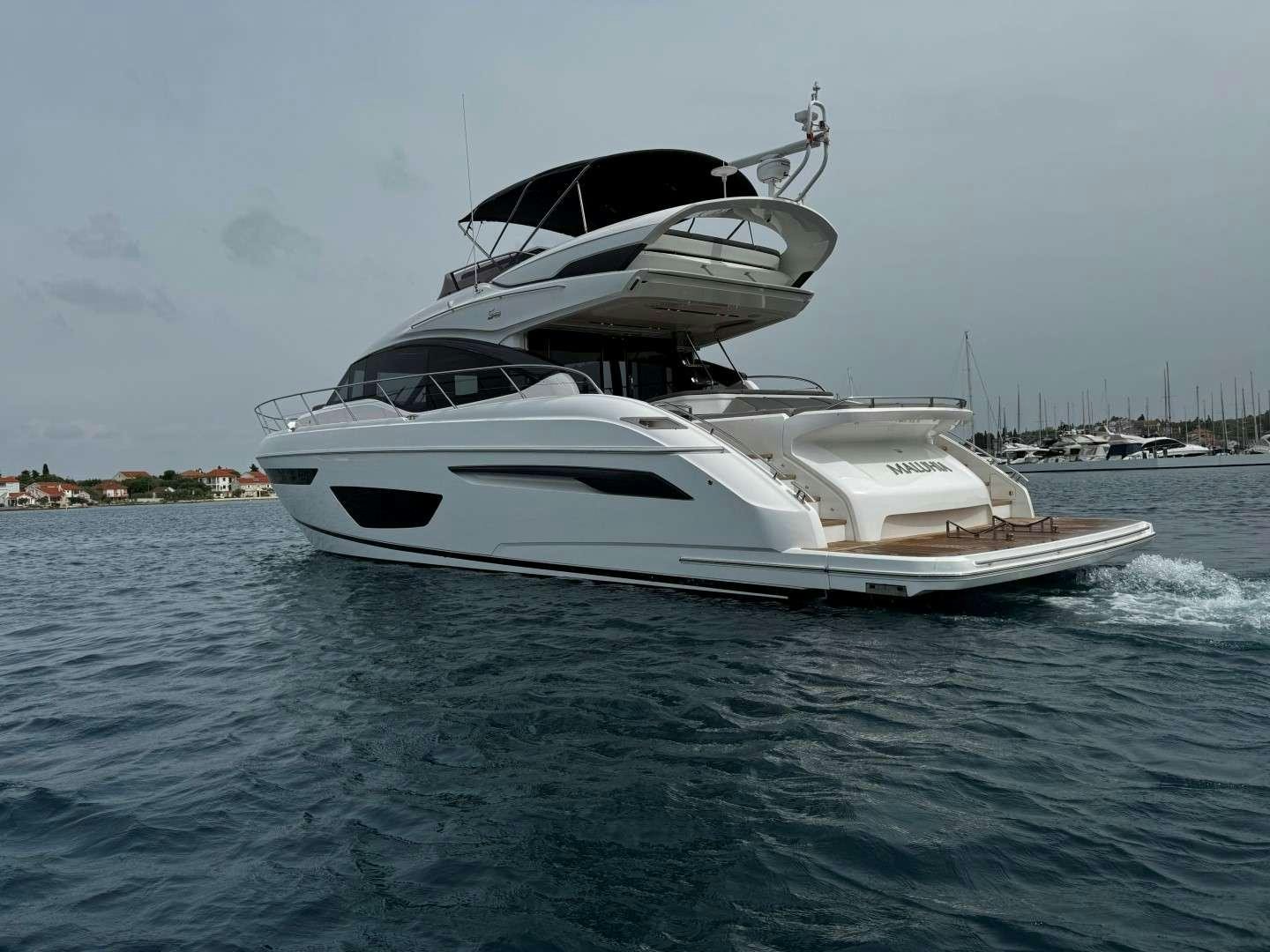 a white yacht on the water aboard MALUHIA Yacht for Charter