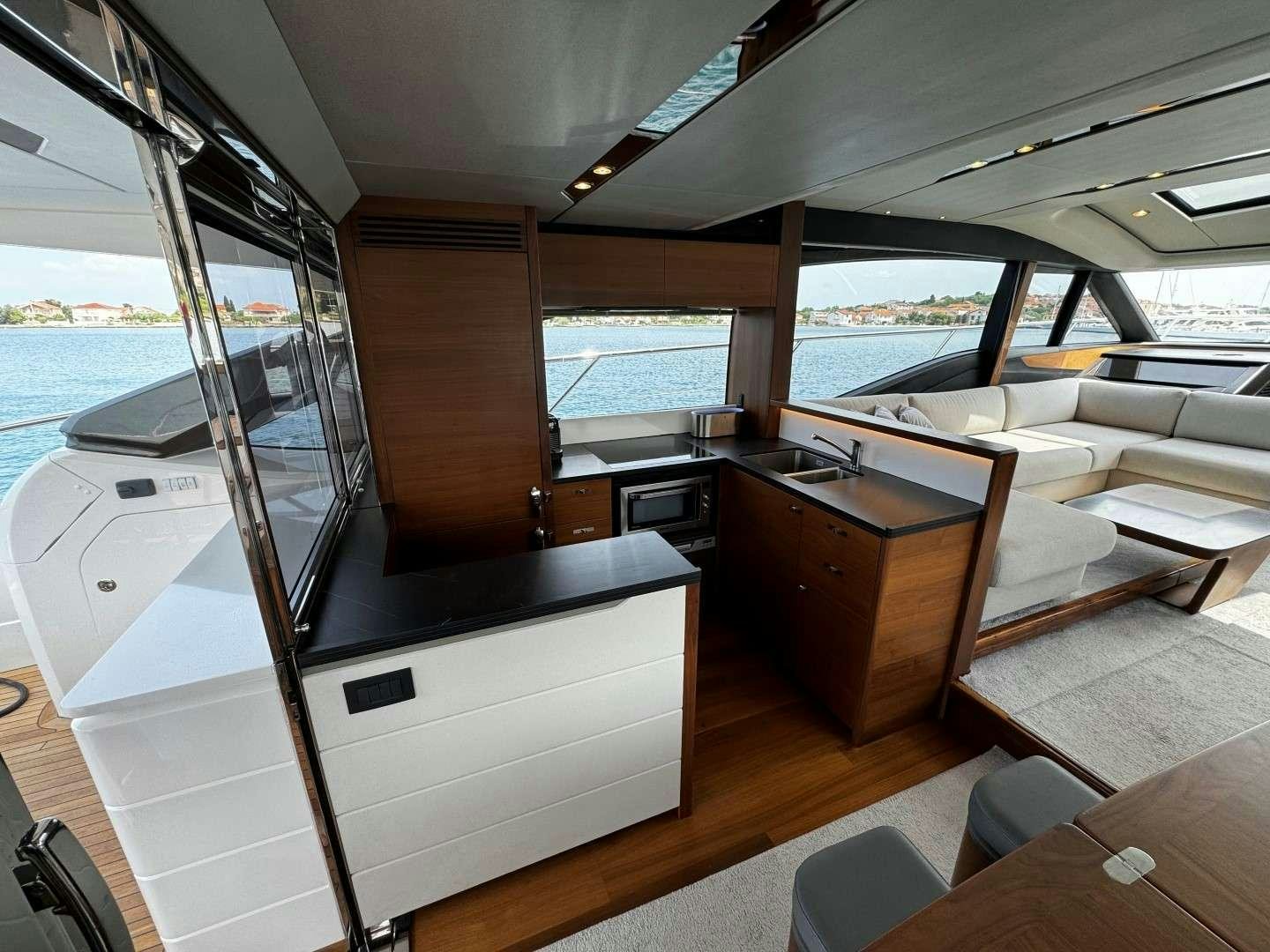 a kitchen with a large window aboard MALUHIA Yacht for Charter