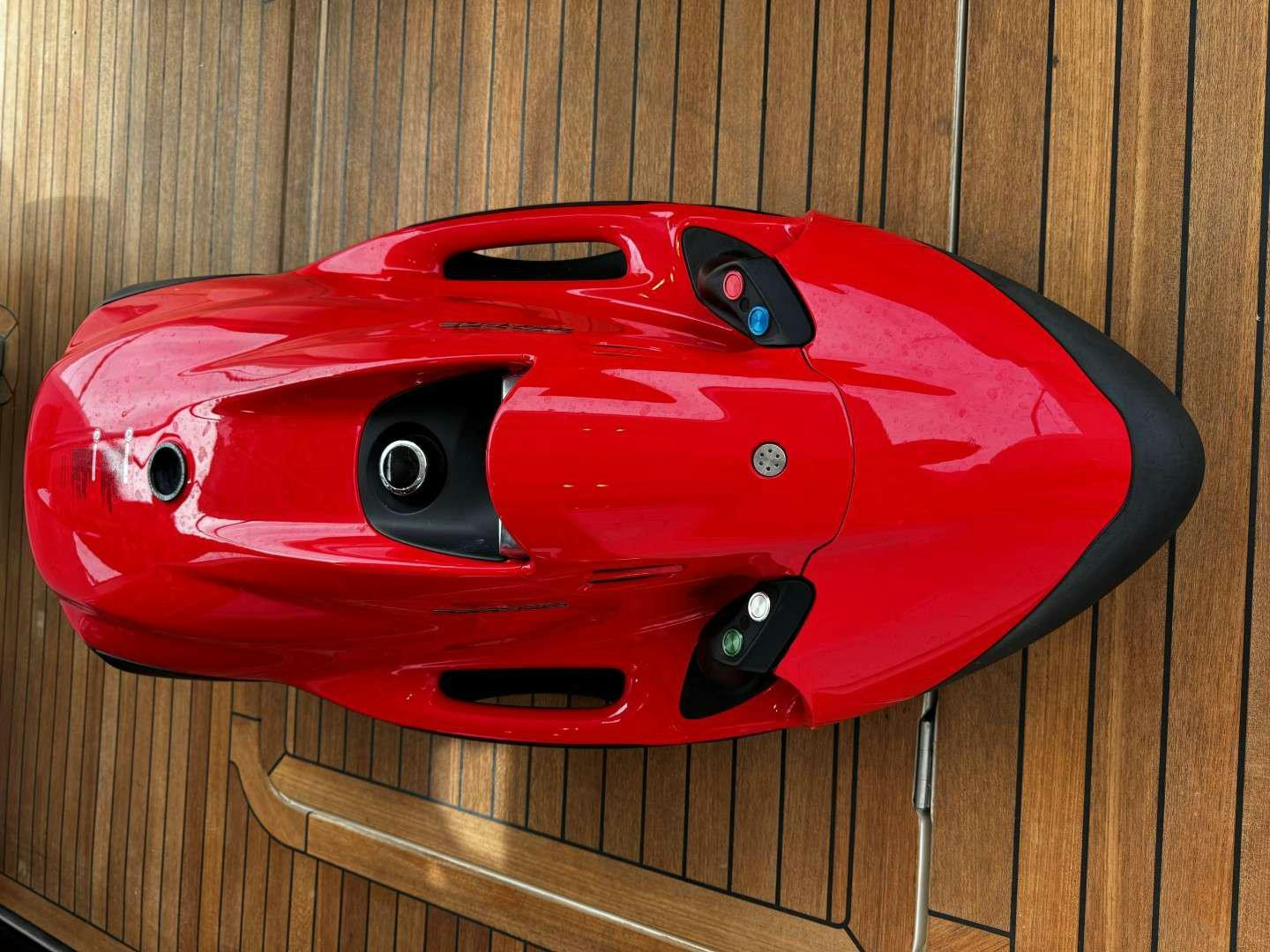 a red car with a face on it aboard MALUHIA Yacht for Charter