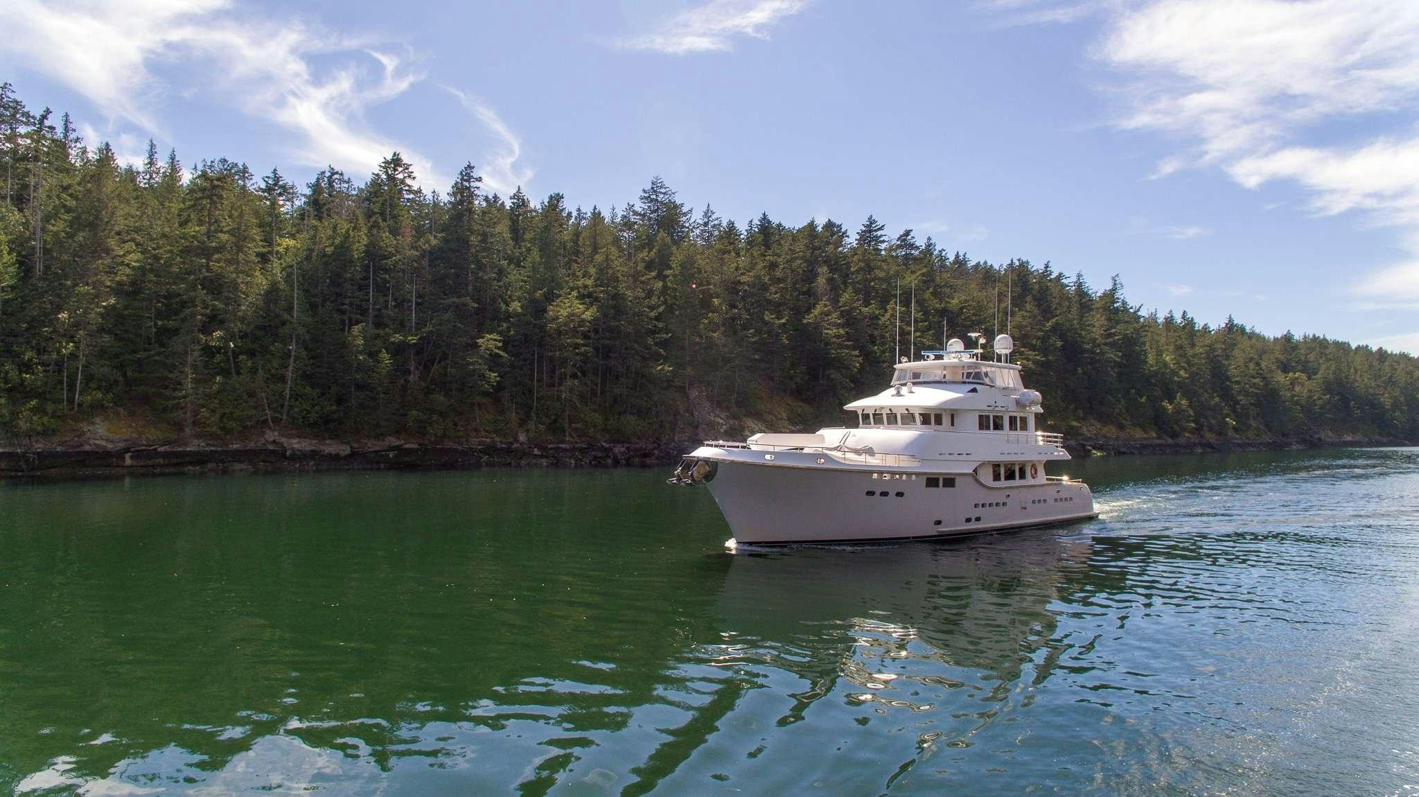 a large white boat on the water aboard SERENDIPITY Yacht for Charter