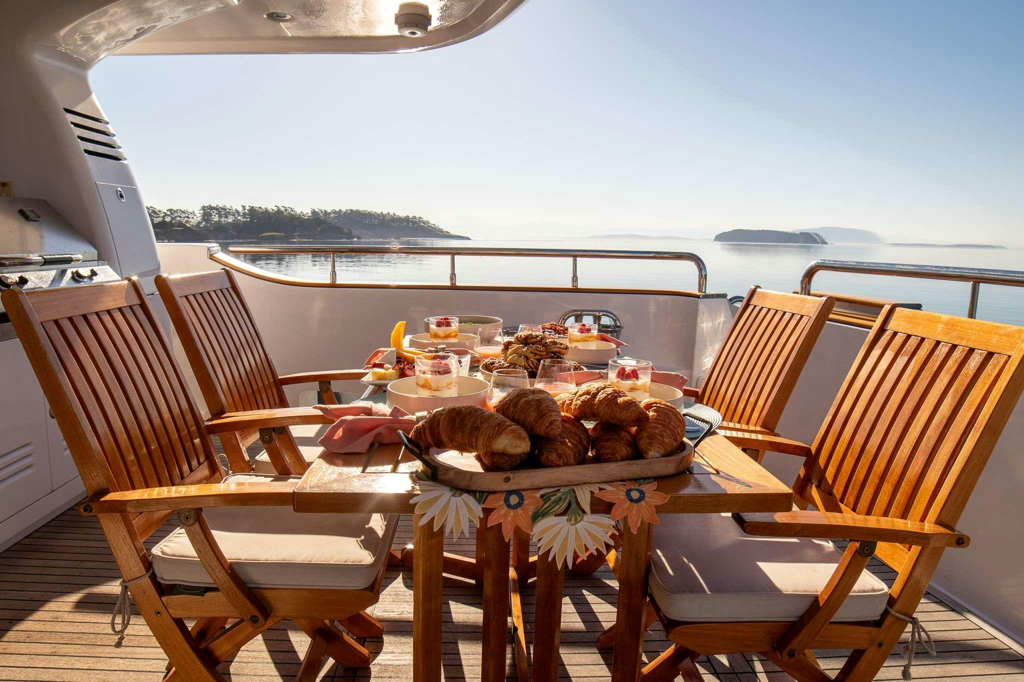 a table with food on it aboard SERENDIPITY Yacht for Charter
