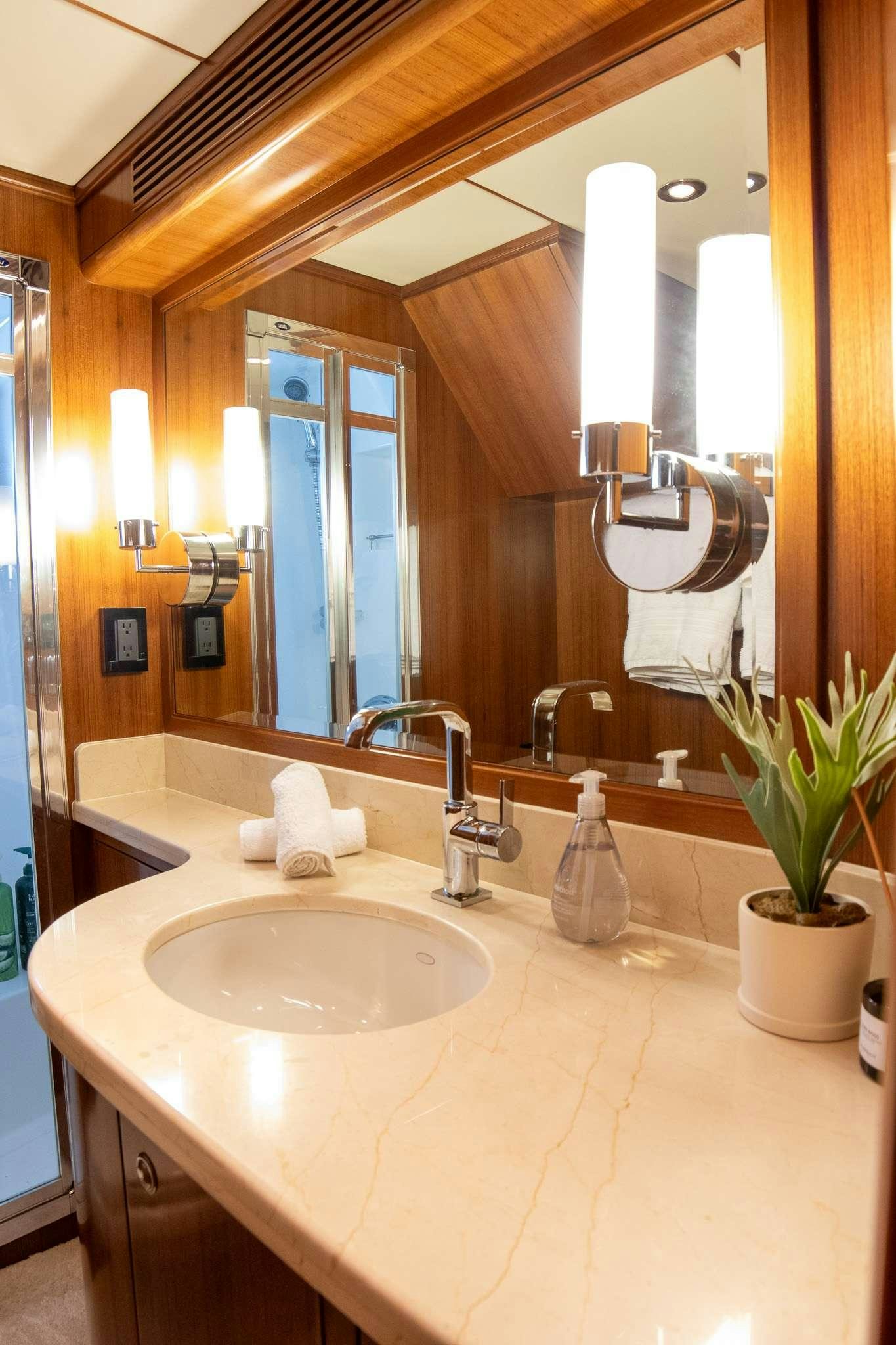 a bathroom with a large mirror aboard SERENDIPITY Yacht for Charter