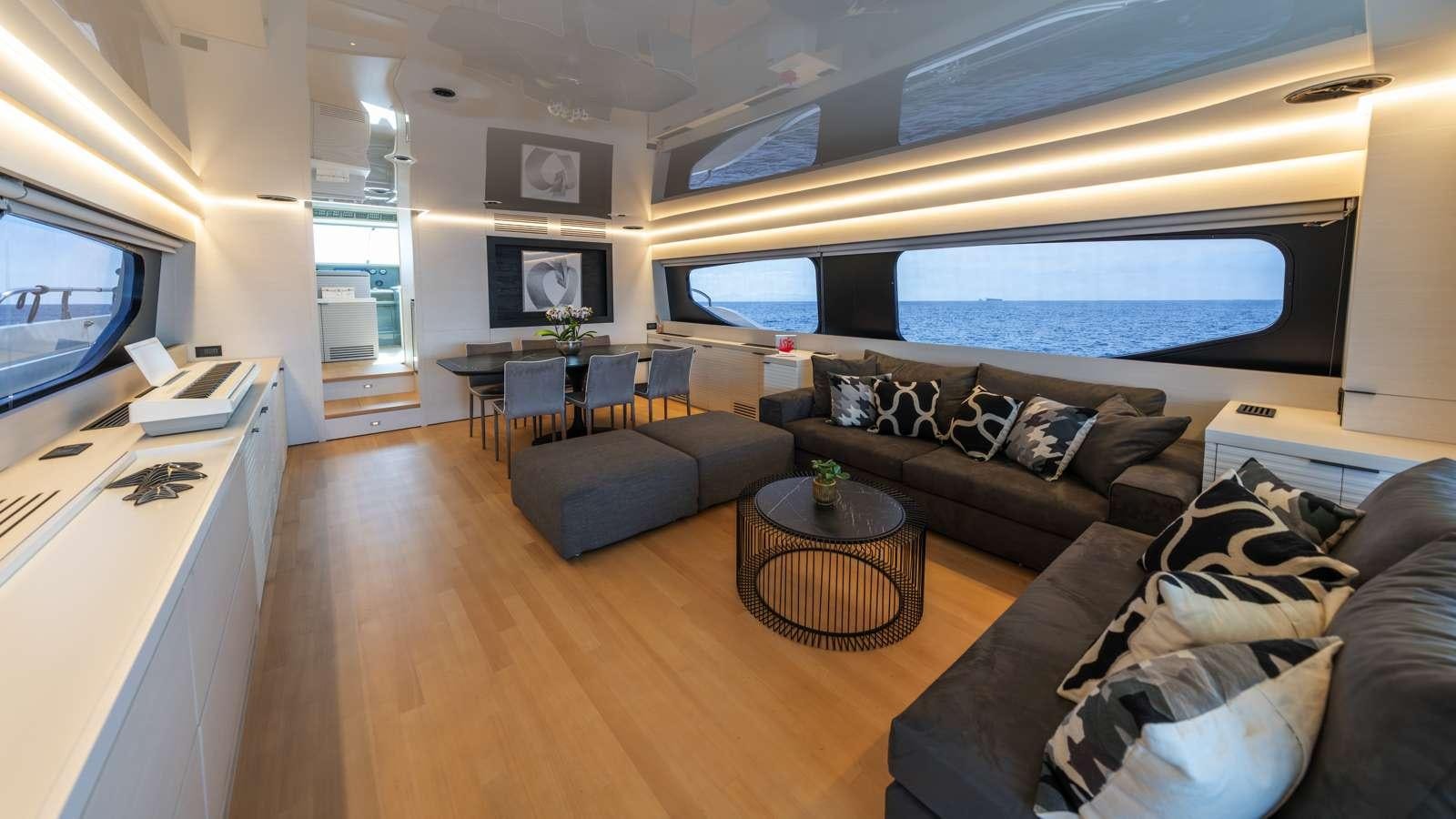 a living room with a large window aboard ALFA Yacht for Charter