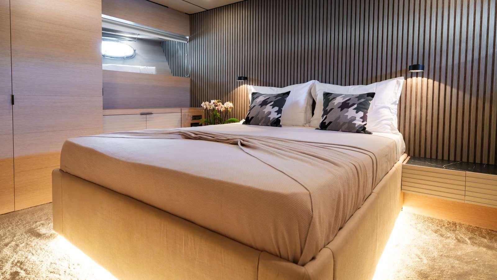 a bed in a room aboard ALFA Yacht for Charter