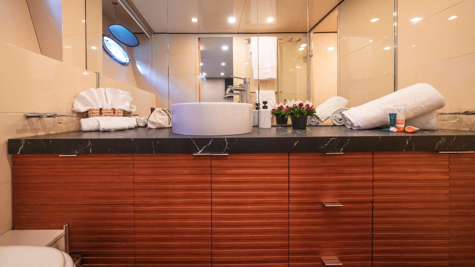 a bathroom with a countertop aboard ALFA Yacht for Charter