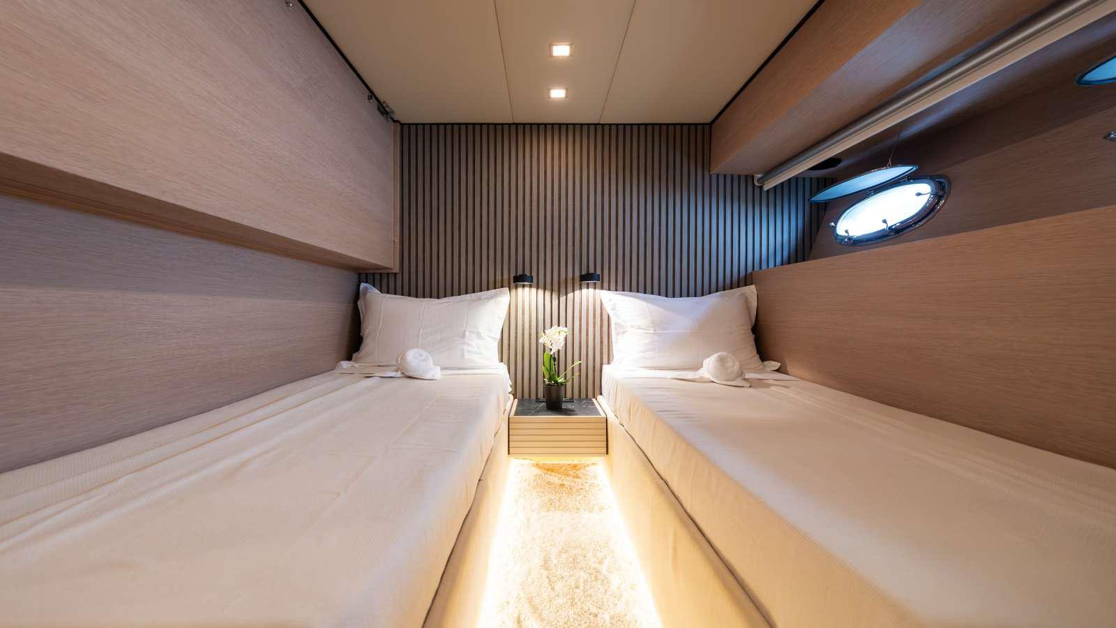 a room with a bed and a window aboard ALFA Yacht for Charter
