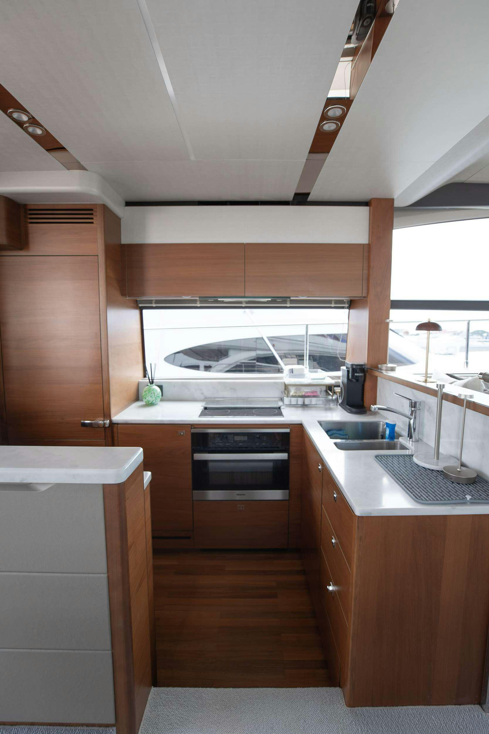 a kitchen with a stove and a sink aboard SABLE Yacht for Charter