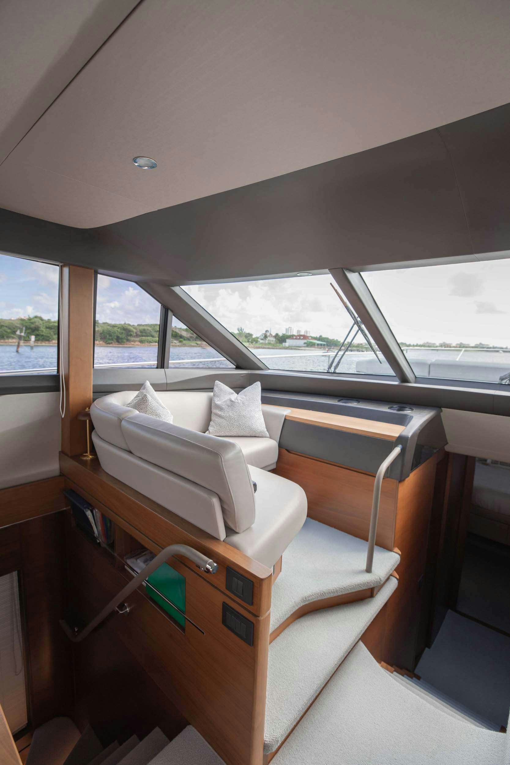 a room with a bed and a desk aboard SABLE Yacht for Charter