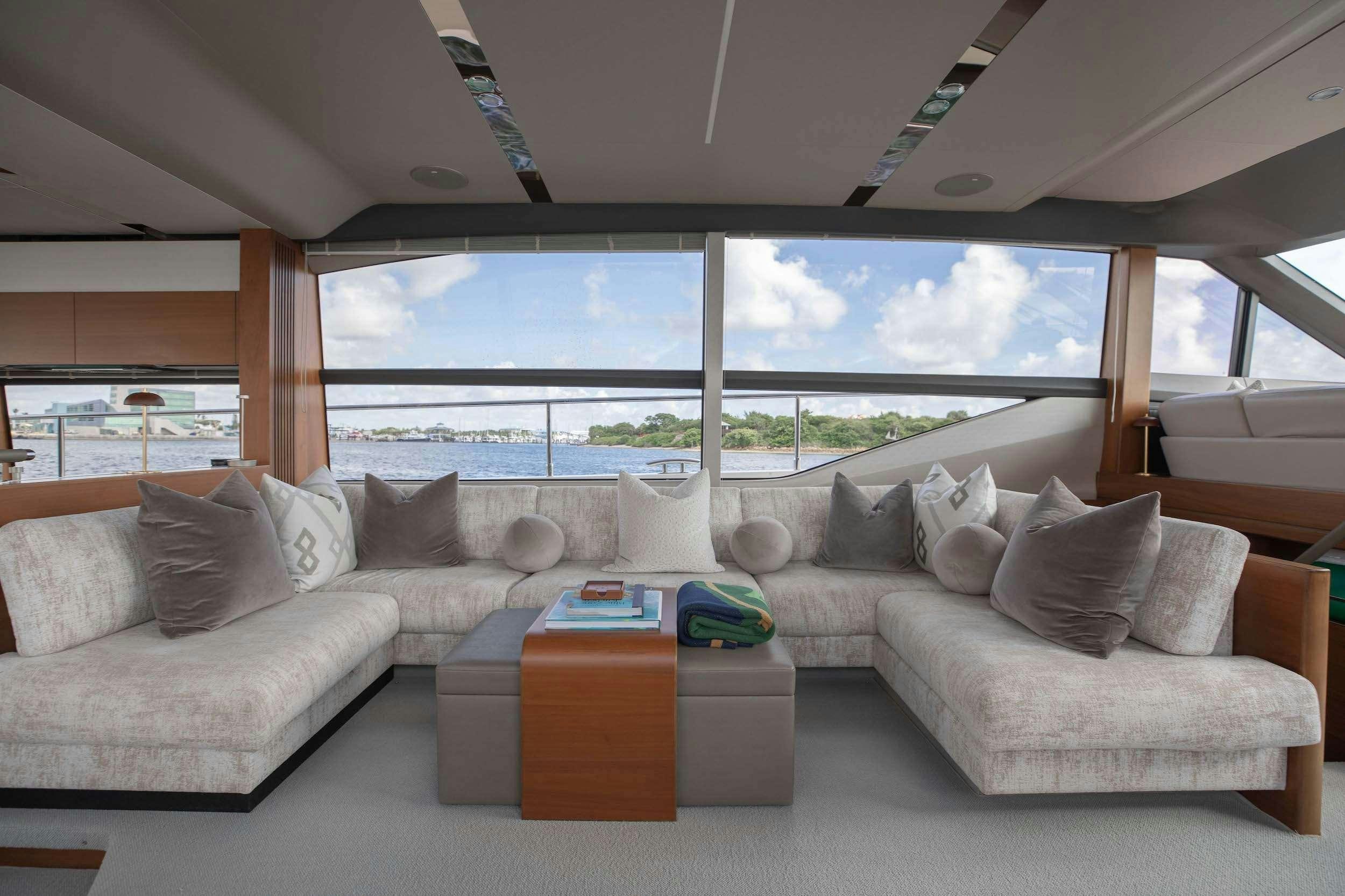 a living room with a large window aboard SABLE Yacht for Charter
