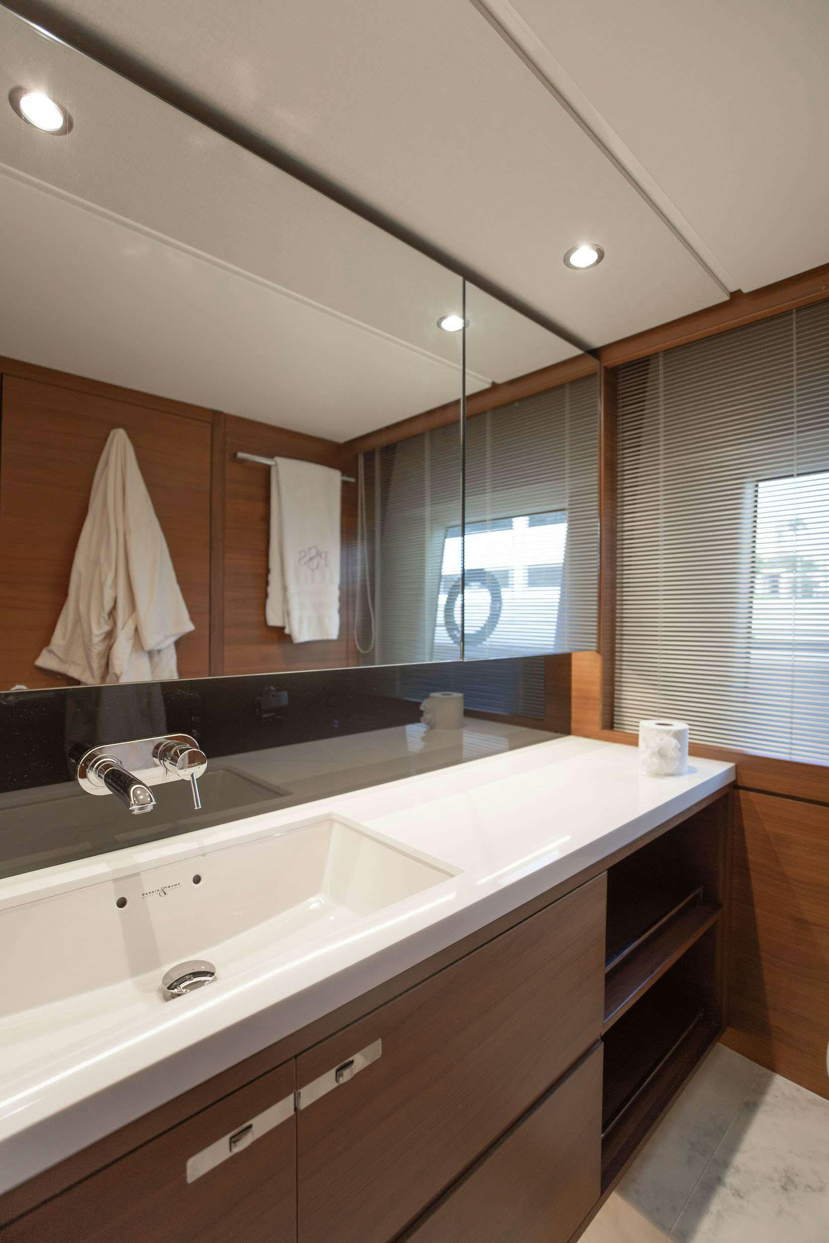 a bathroom with a large mirror aboard SABLE Yacht for Charter