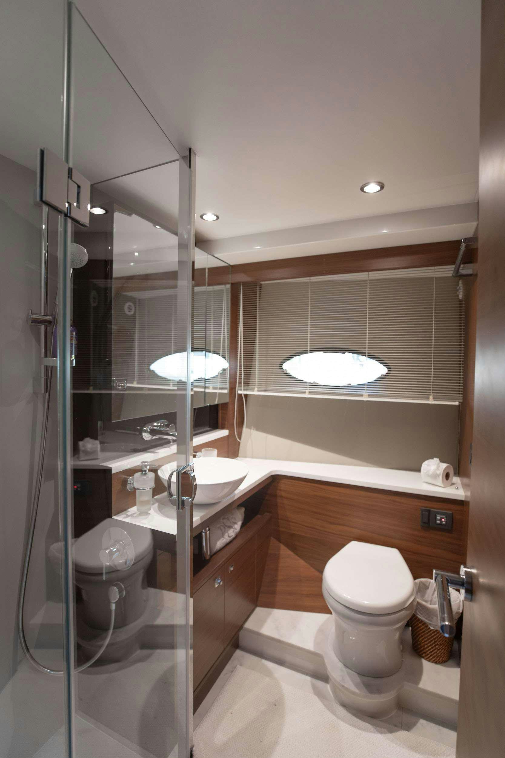 a bathroom with a glass shower aboard SABLE Yacht for Charter