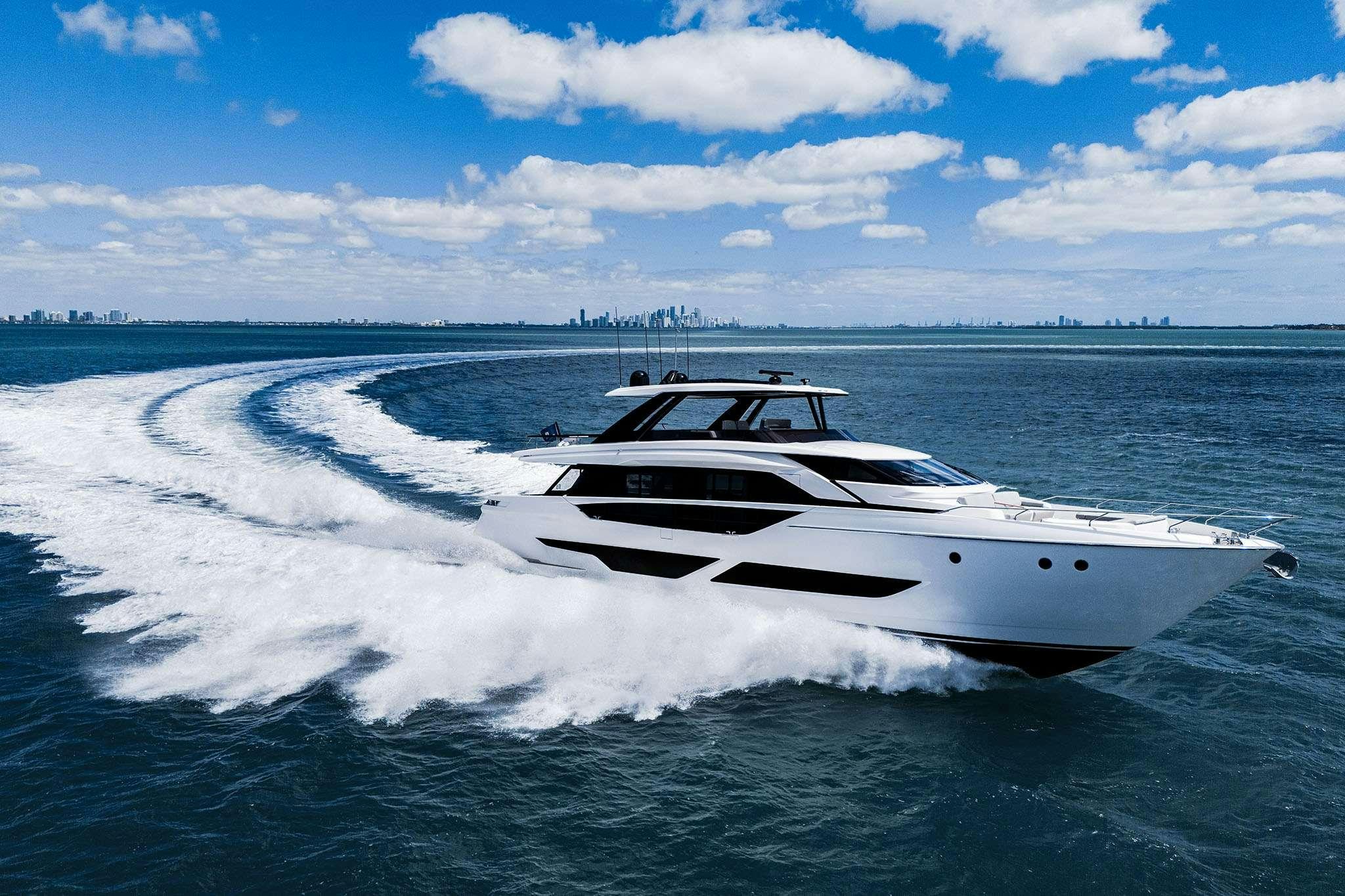 a white yacht on the water aboard 5 PALMS Yacht for Charter