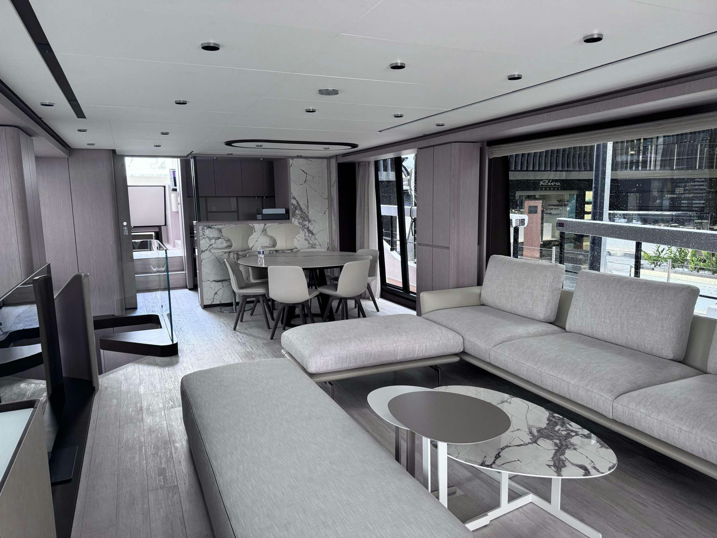 a living room with a couch and a table aboard 5 PALMS Yacht for Charter