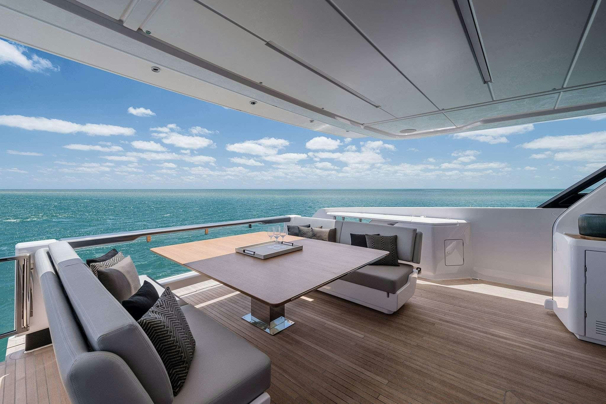 a room with a table and chairs aboard 5 PALMS Yacht for Charter