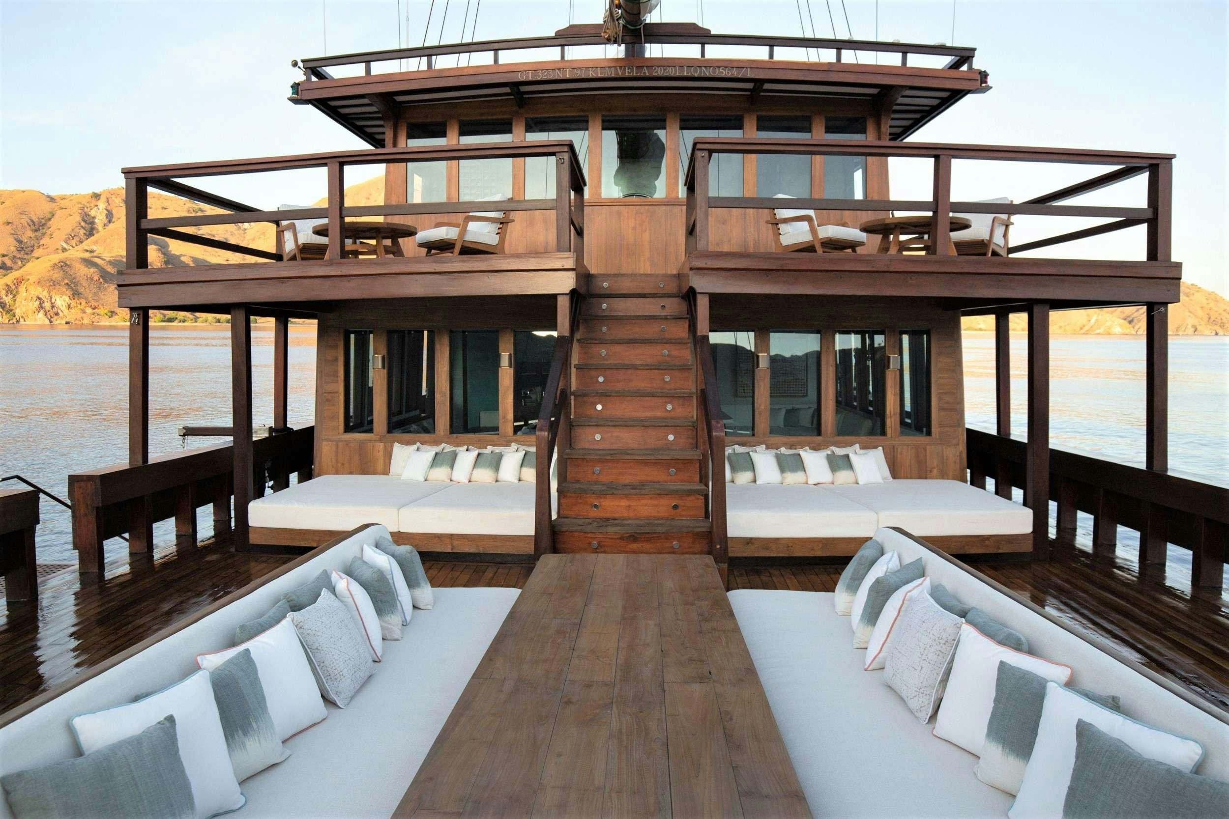 a cabin with a deck aboard VELA Yacht for Charter