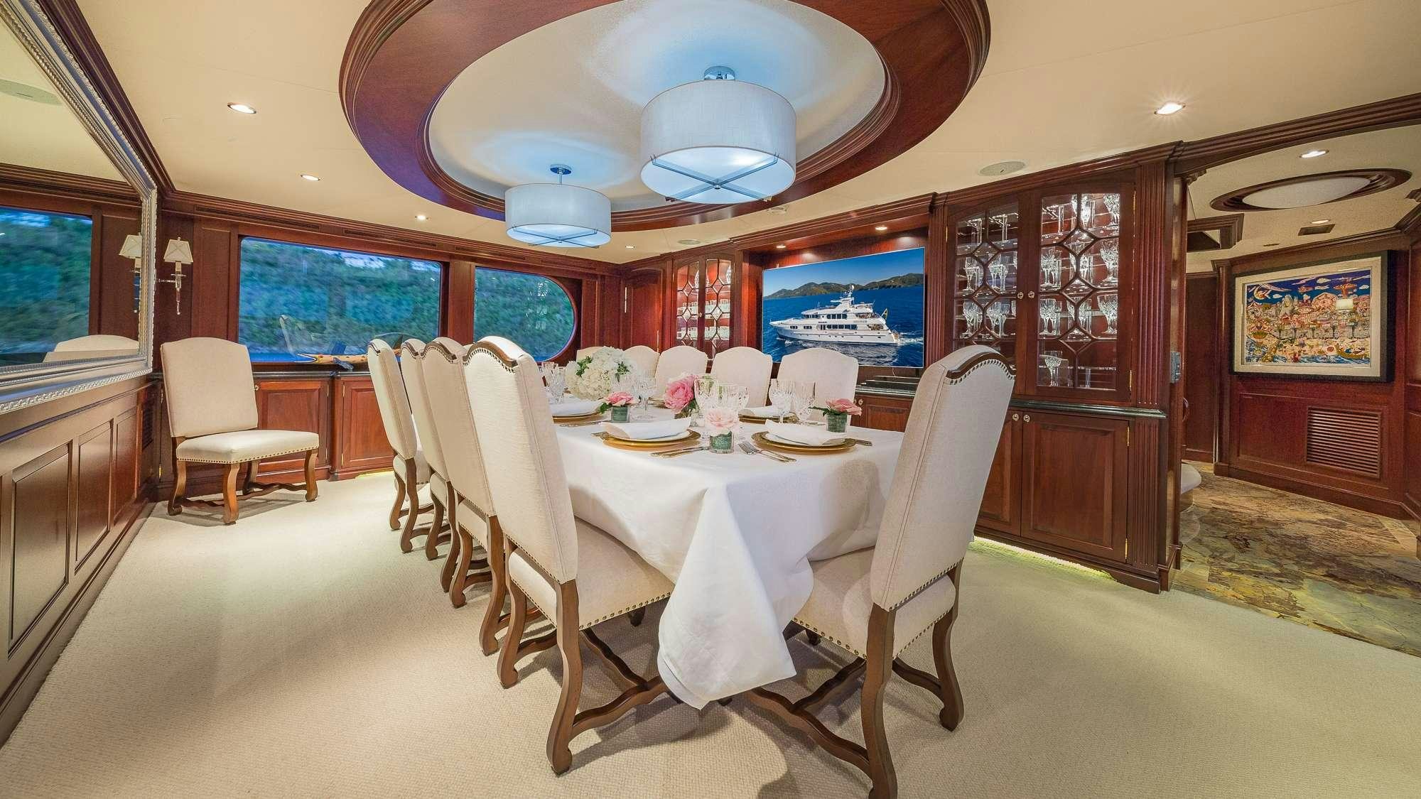 a dining room with a table and chairs aboard KING OF FUN Yacht for Charter