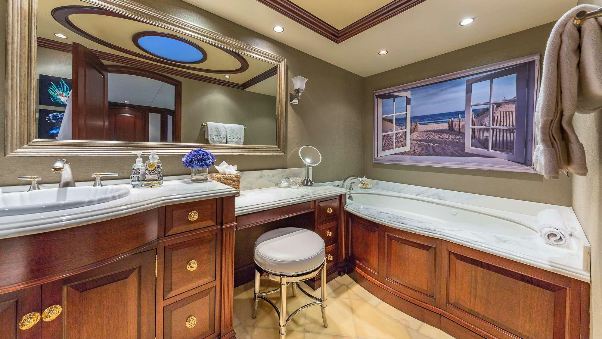 a bathroom with a large mirror aboard KING OF FUN Yacht for Charter