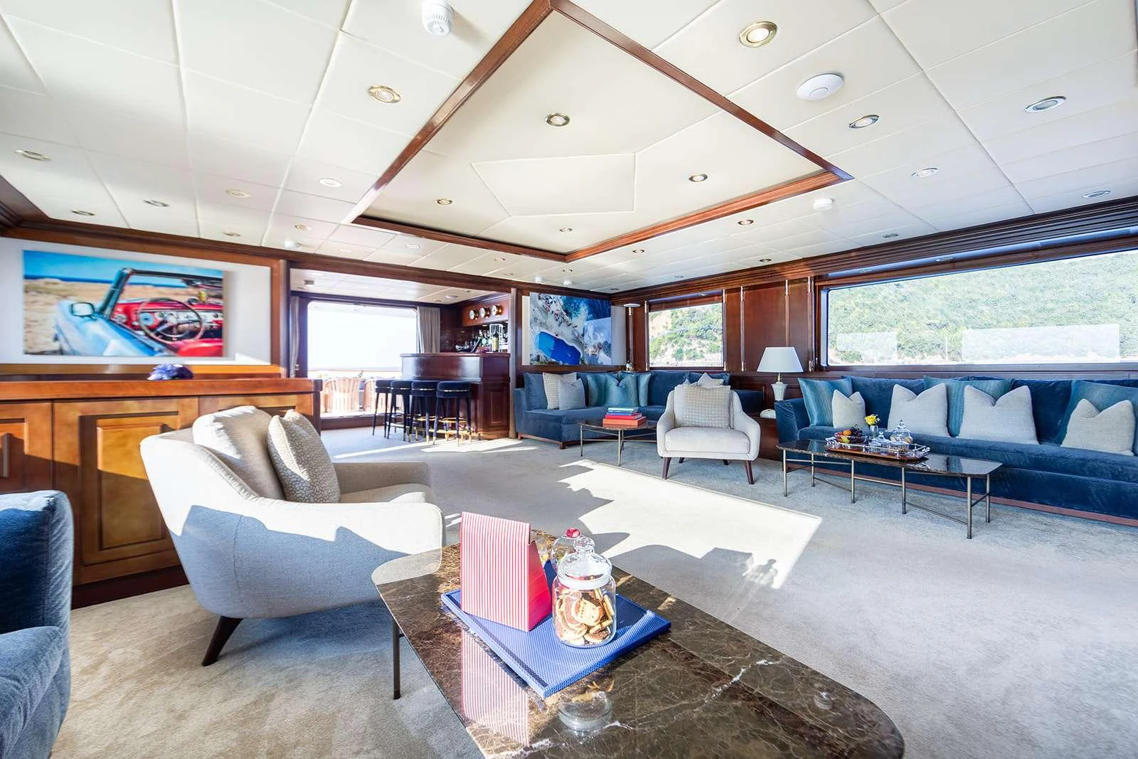 a living room with a large open window aboard SOPHIE BLUE Yacht for Charter