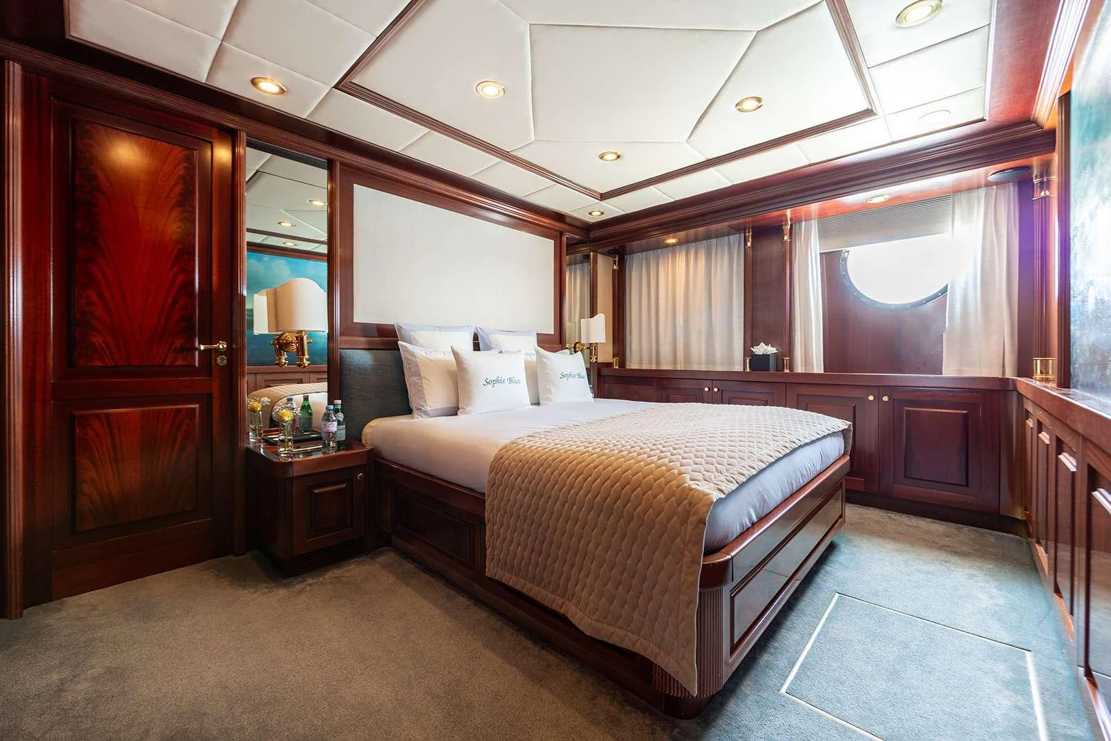 a large bedroom with a bed aboard SOPHIE BLUE Yacht for Charter