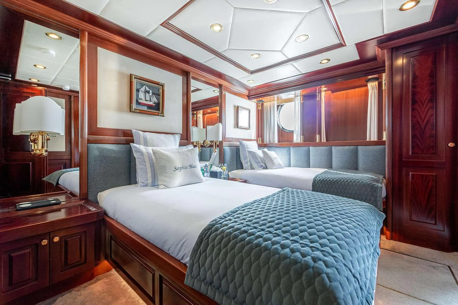 a room with a bed and a desk aboard SOPHIE BLUE Yacht for Charter