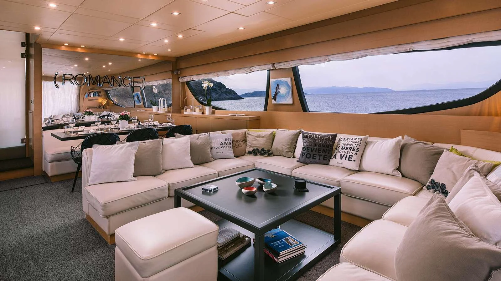 a living room with a couch and a table aboard SEAS THE DAY Yacht for Charter