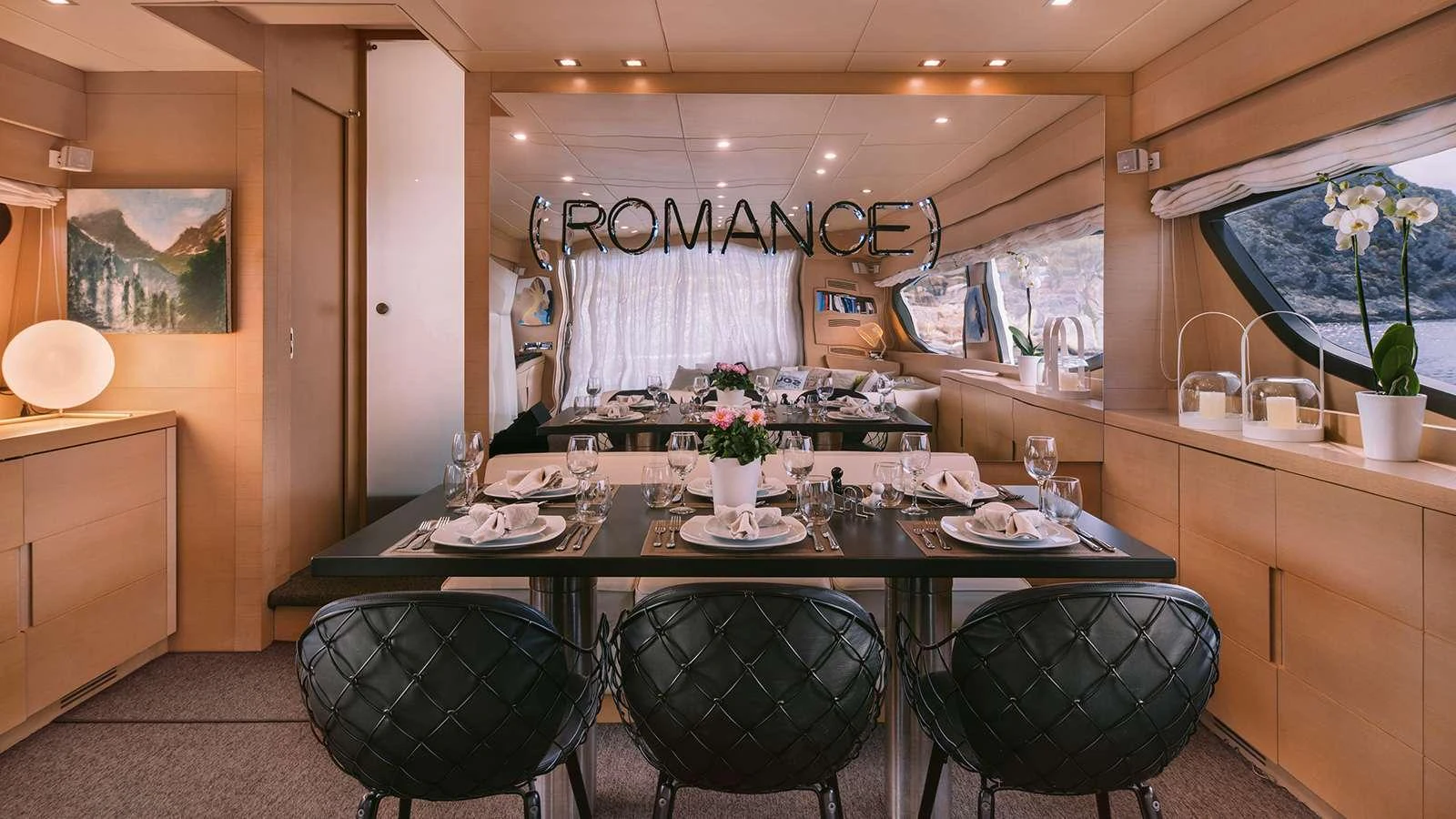 a dining table set for a dinner aboard SEAS THE DAY Yacht for Charter