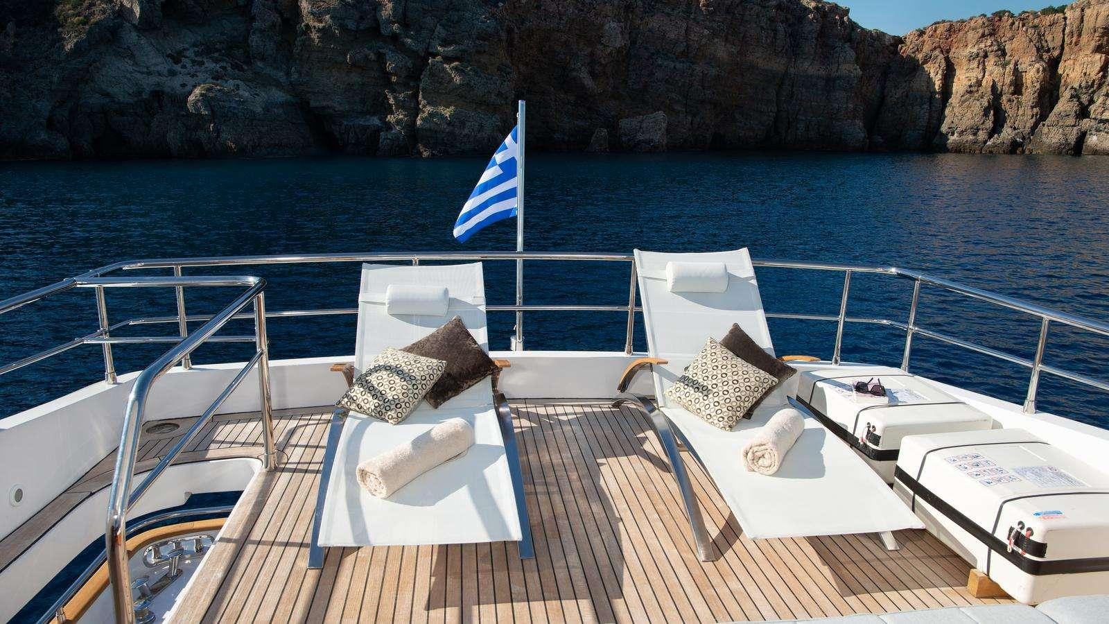 a boat with chairs on it aboard EL PECADO Yacht for Charter