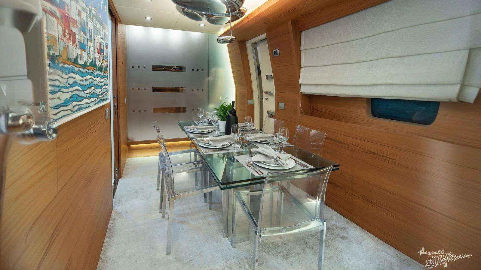 a dining table in a room aboard EL PECADO Yacht for Charter