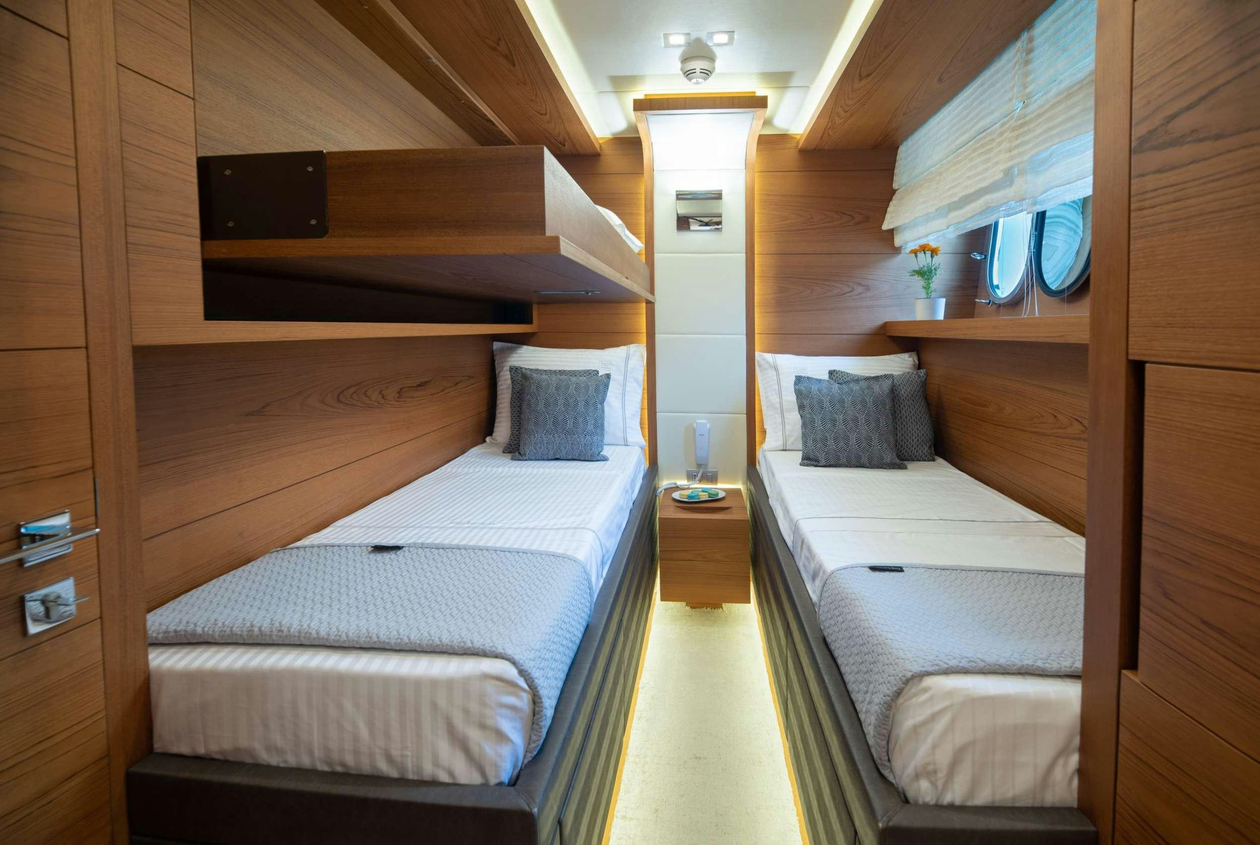 a room with bunk beds aboard EL PECADO Yacht for Charter