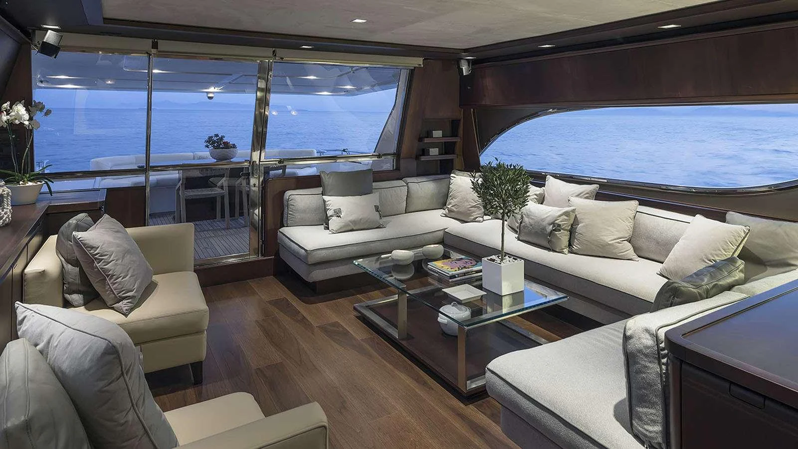 a living room with a large window aboard LAZY DAYS Yacht for Charter