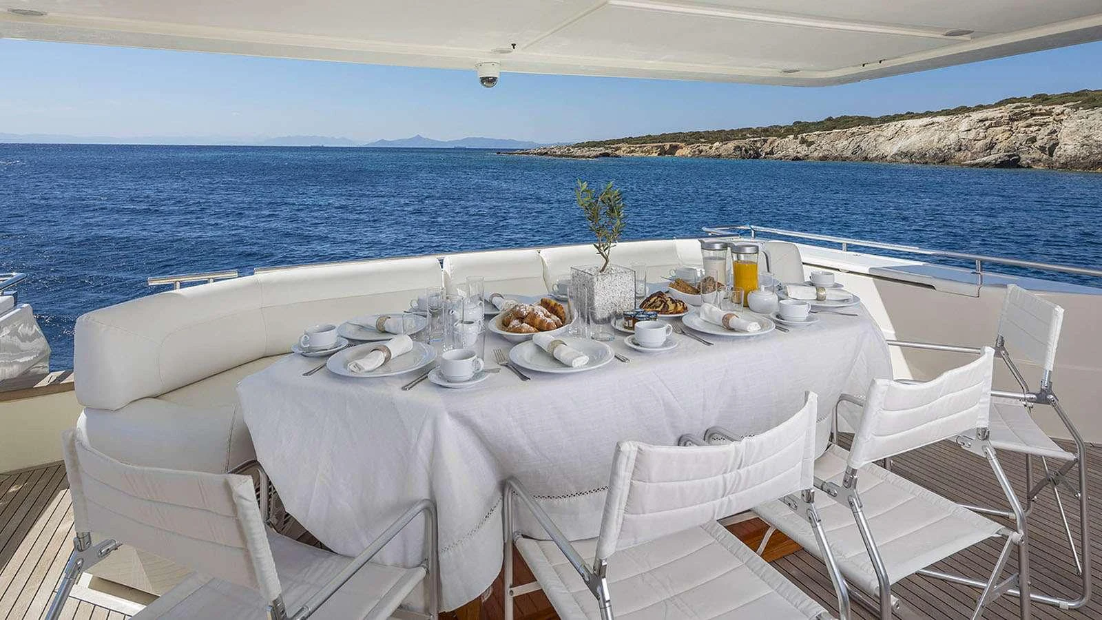 a table set for a meal on a boat aboard LAZY DAYS Yacht for Charter