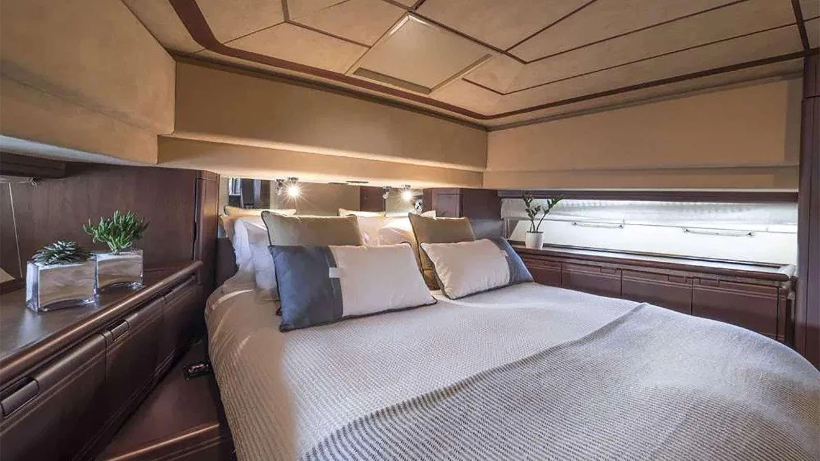 a bed with white sheets aboard LAZY DAYS Yacht for Charter