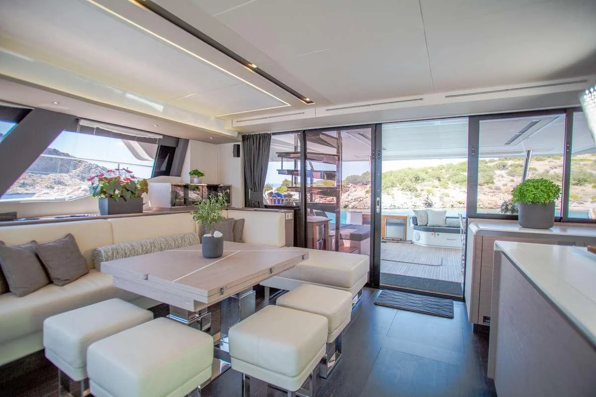 a room with a couch and a table aboard MAJESTY OF GREECE Yacht for Charter